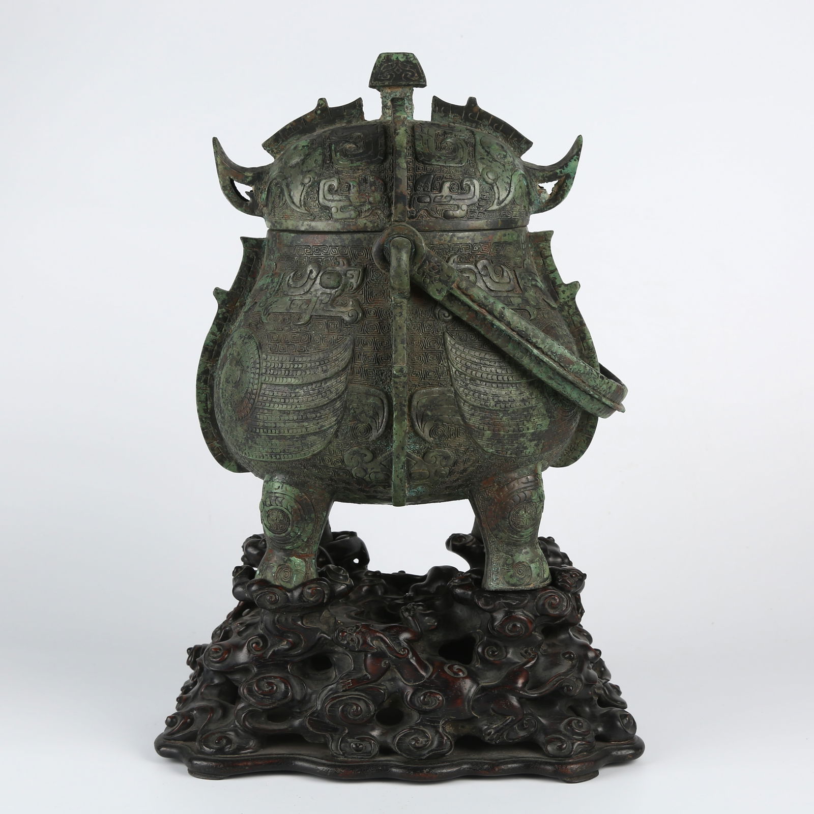 A BRONZE CARVED BEAST PATTERN HANDLE-HANDLED YOU VESSEL (1 of 16)