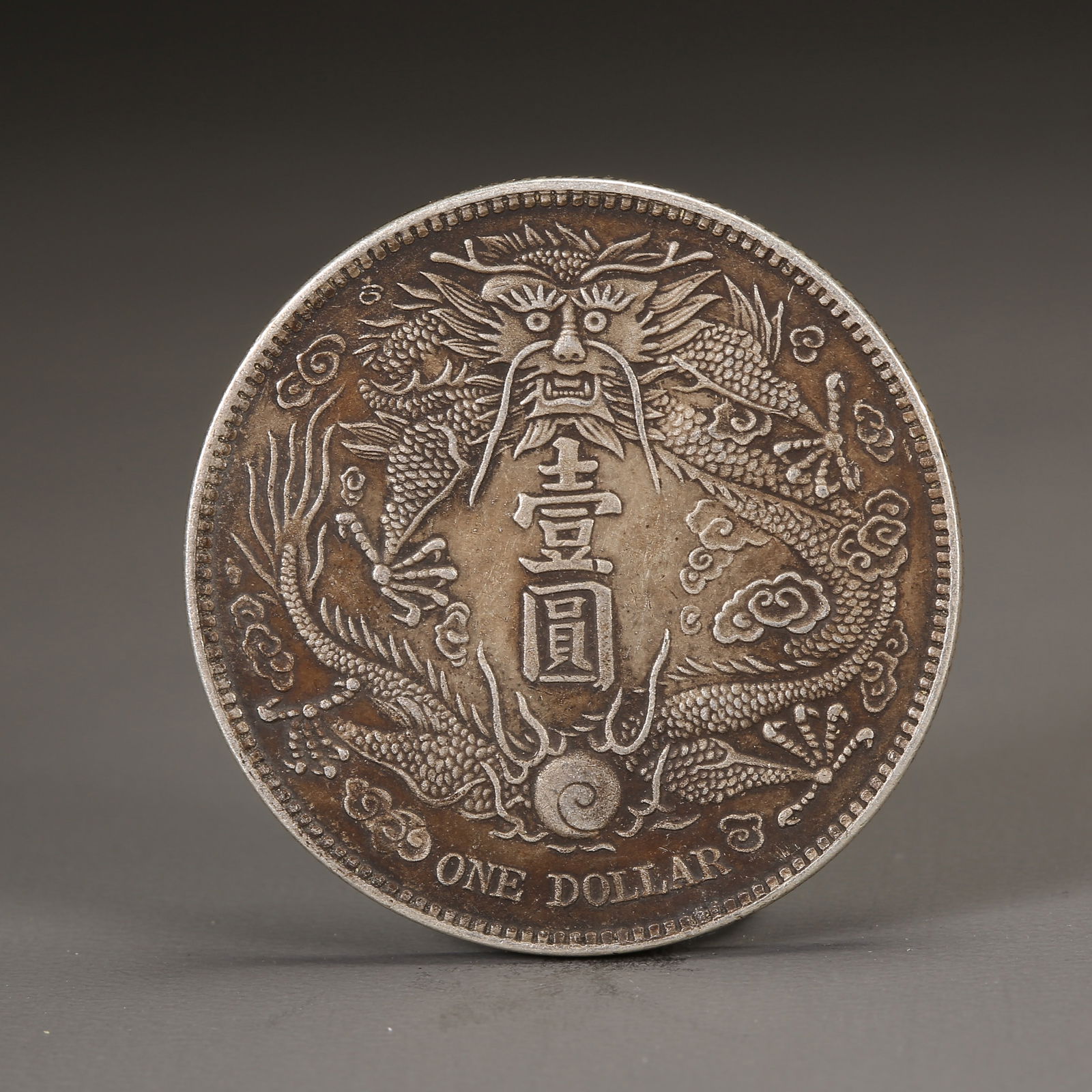 A SILVER DOLLAR COIN (1 of 3)
