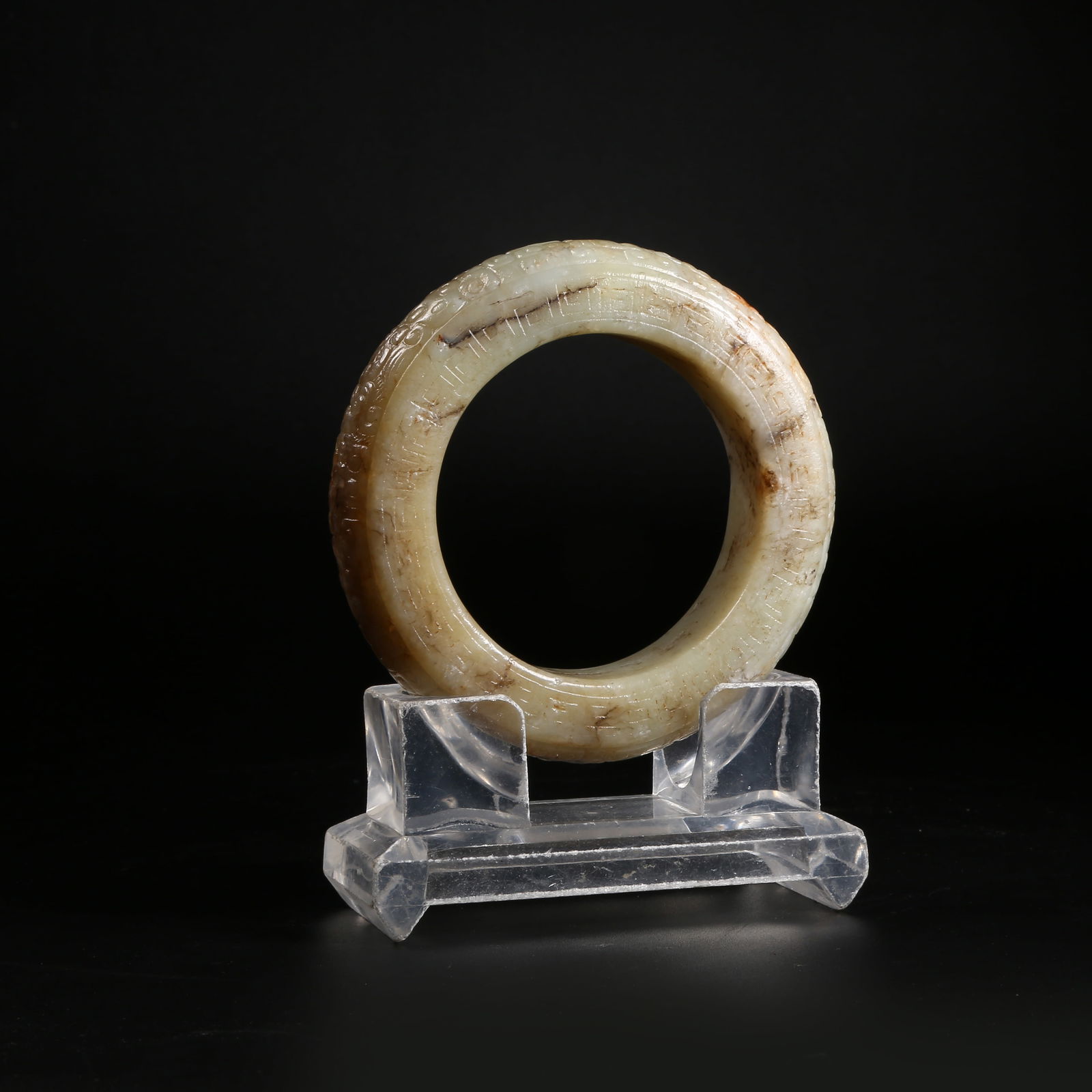 A ARCHAIC JADE BRACELET WITH HOOK-AND-CLOUD PATTERN (1 of 8)