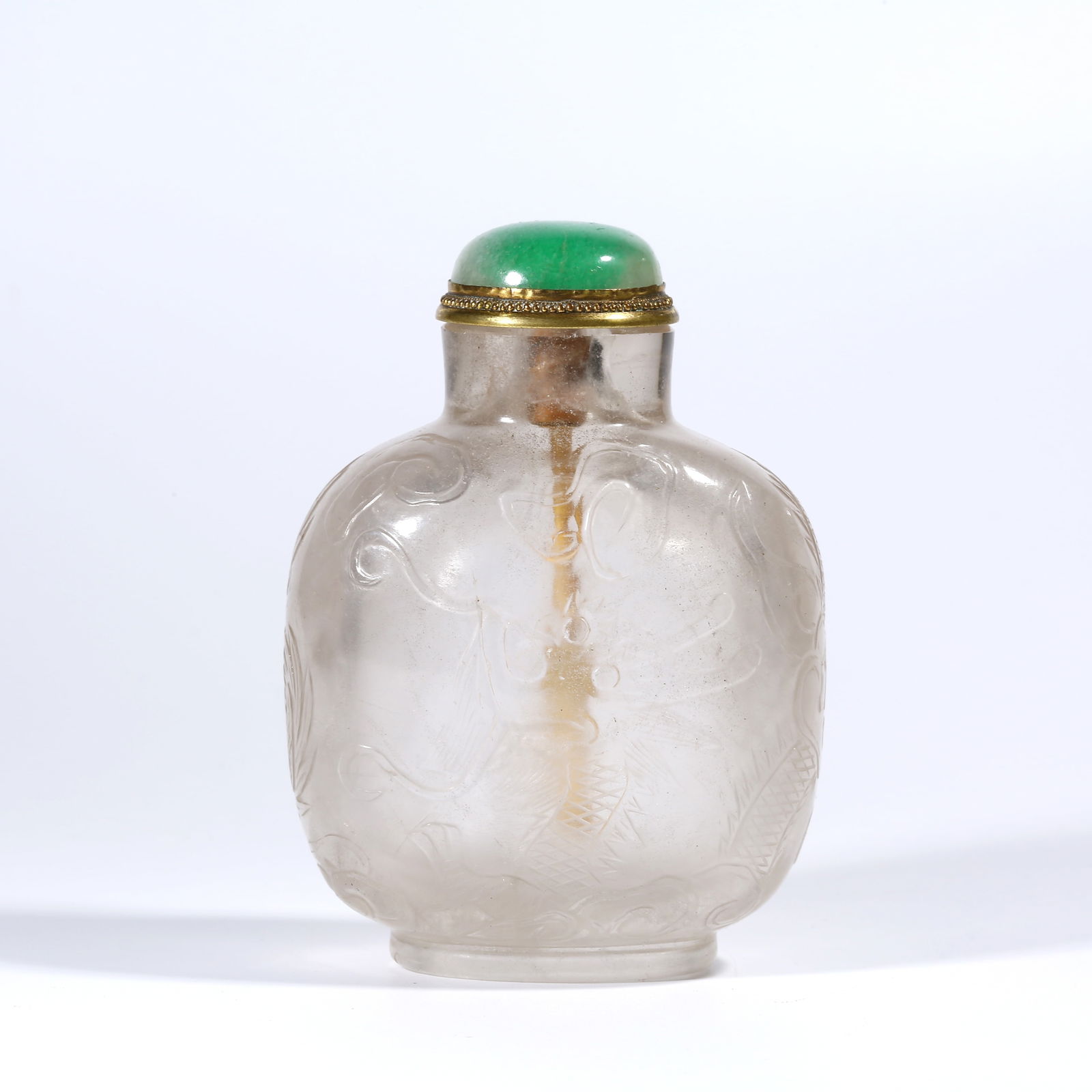 A CRYSTAL SNUFF BOTTLE WITH CLOUD AND DRAGON PATTERN (1 of 9)