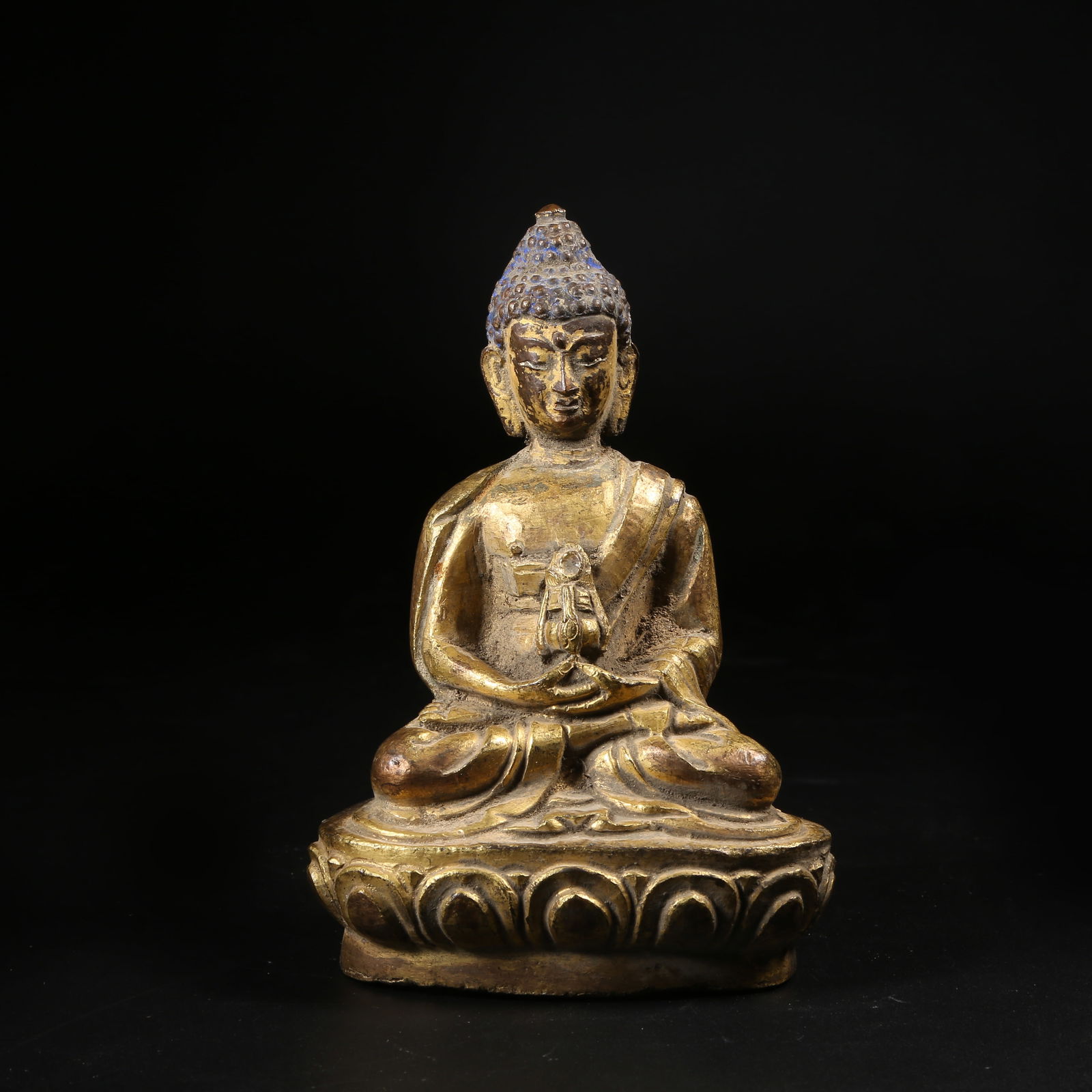 A GILT-BRONZE STANDING LAMP-BEARING BUDDHA FIGURE (1 of 8)