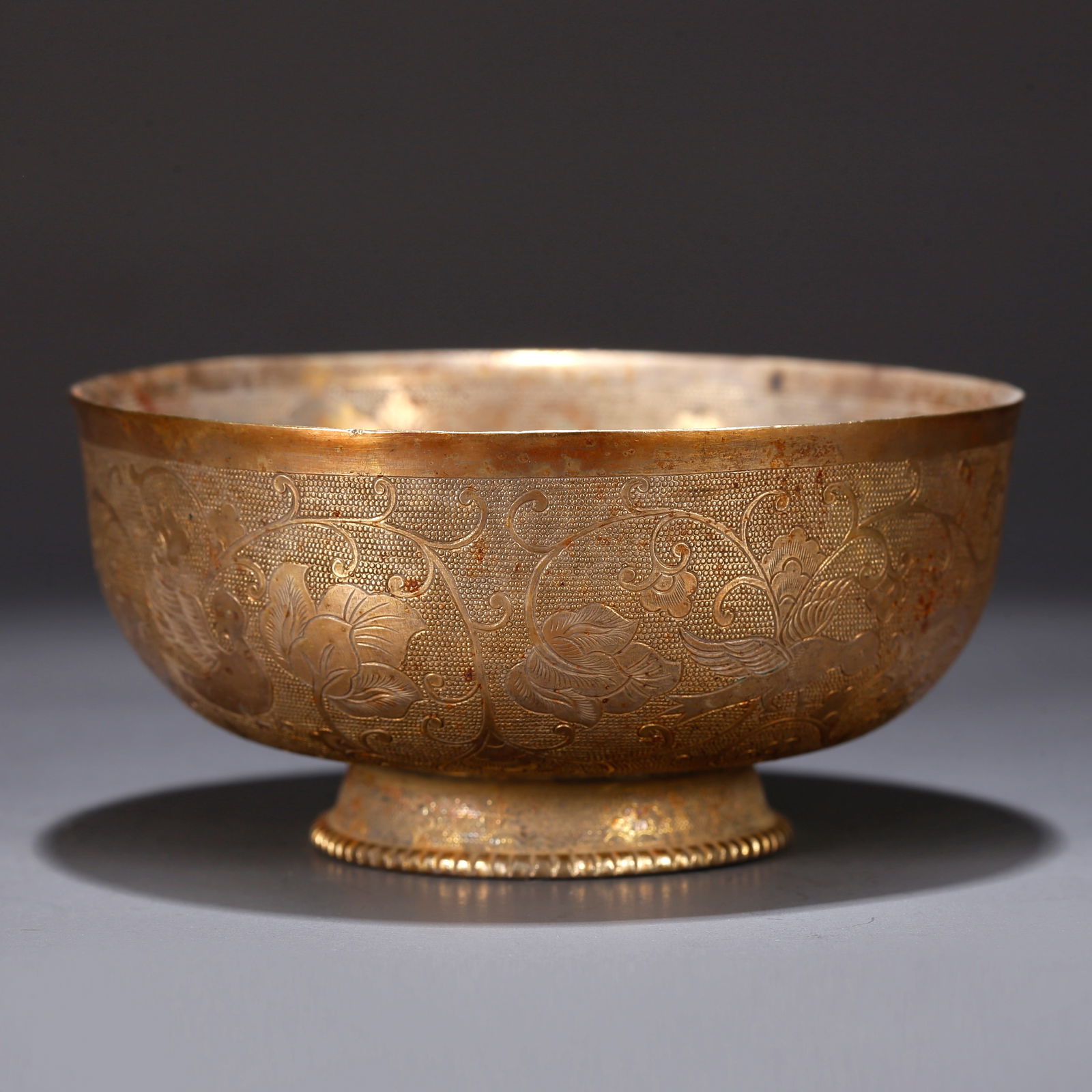 A GILT BRONZE BOWL WITH FLORAL DESIGN: Gilt bronze bowl with floral design