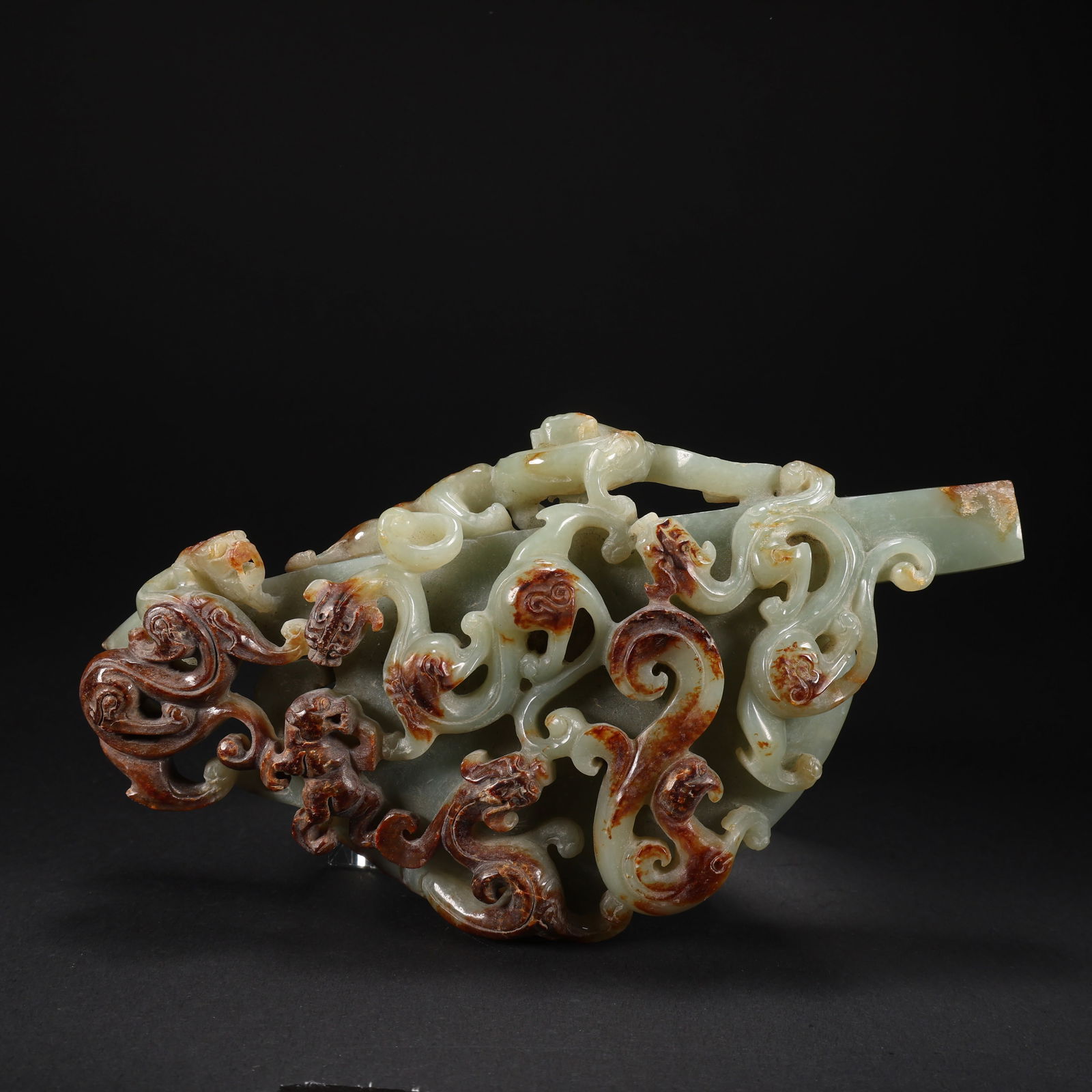 A HETIAN JADE RELIEF AXE WITH FIVE DRAGONS AND ONE PHOENIX (1 of 9)
