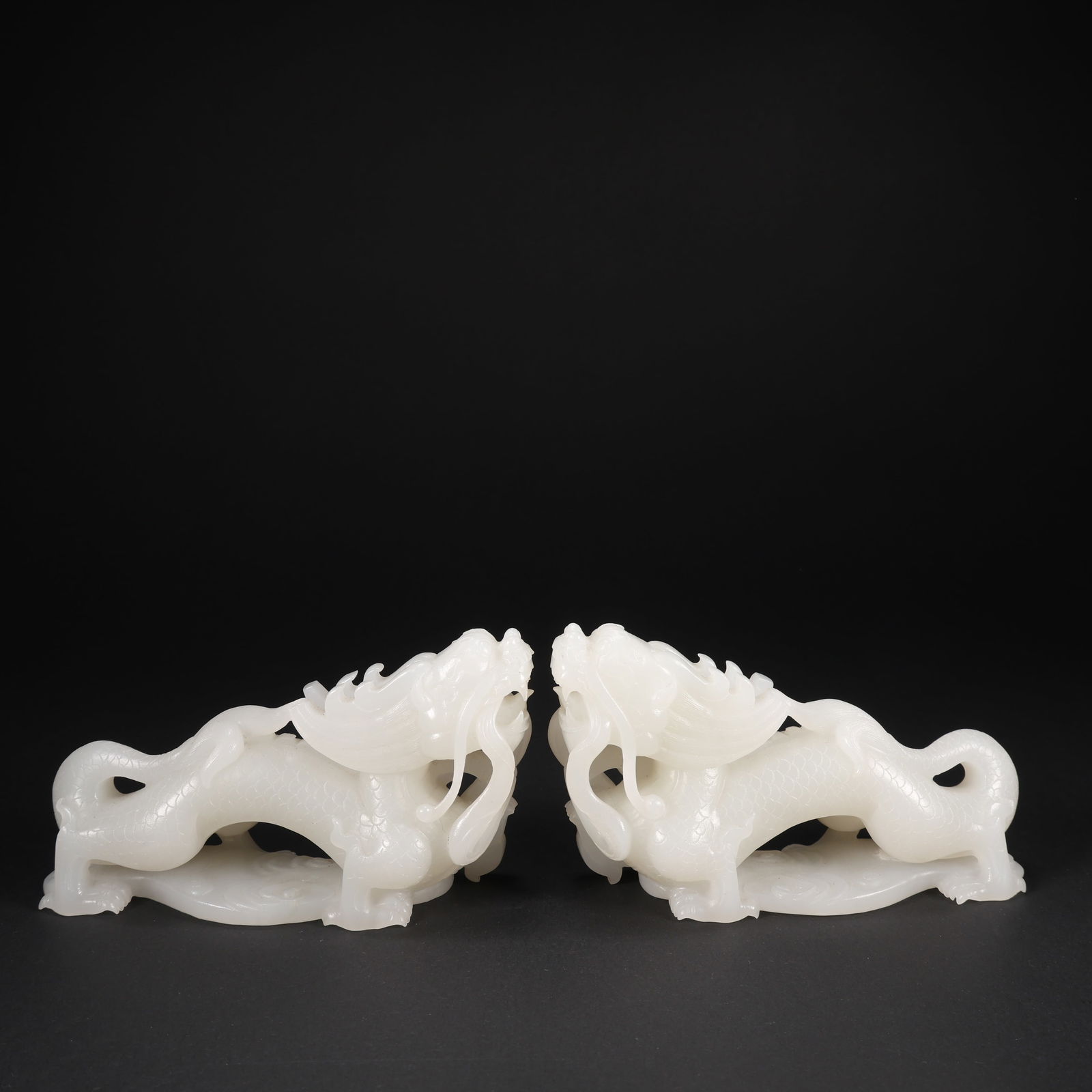 A PAIR OF HETIAN JADE BEASTS (1 of 9)