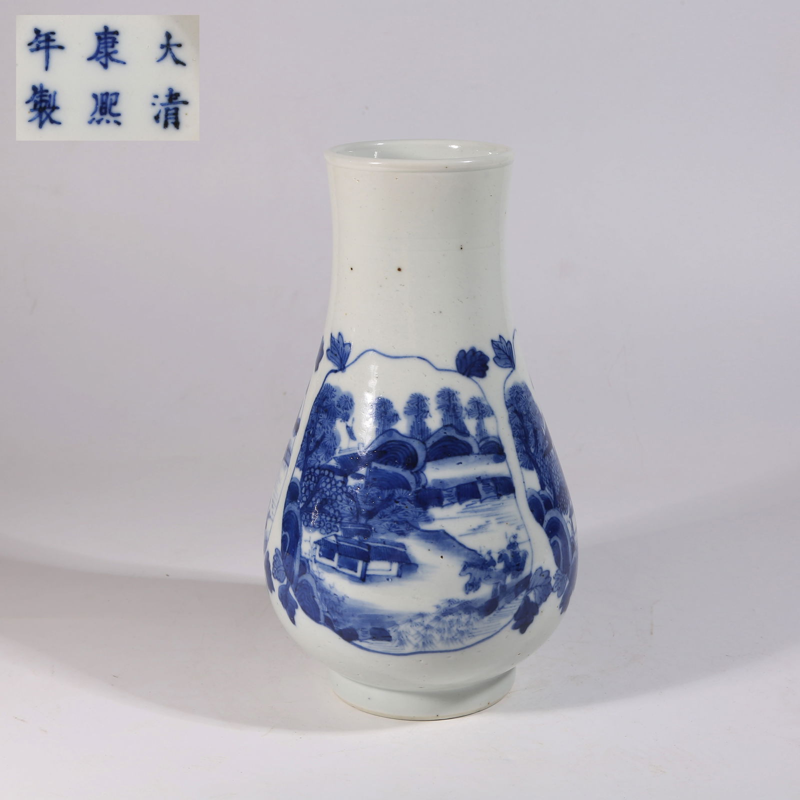 A BLUE-AND-WHITE PIPA-SHAPED WINE VESSEL WITH LANDSCAPE DESIGN: Blue-and-White Pipa-Shaped Wine Vessel with Landscape Design