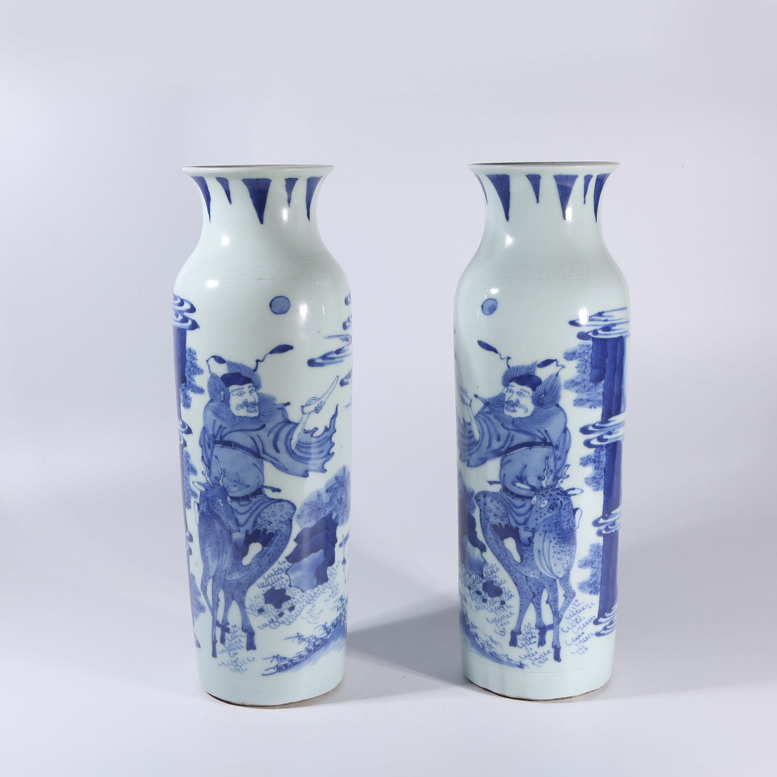 A SET OF BLUE-AND-WHITE PESTLE-SHAPED VASES WITH ZHONG KUI MOTIF (1 of 10)