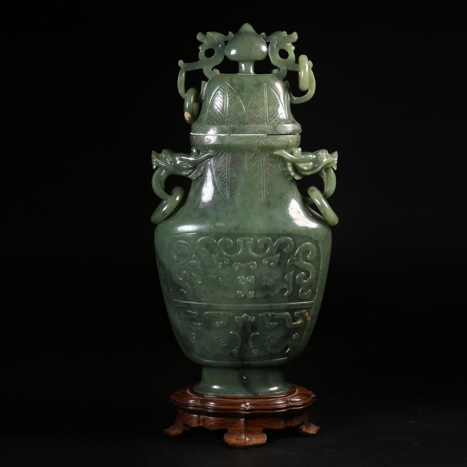 A HETIAN SPINACH-GREEN JADE COVERED BOTTLE WITH ANTIQUITIES MOTIFS AND DRAGON HANDLES (1 of 9)