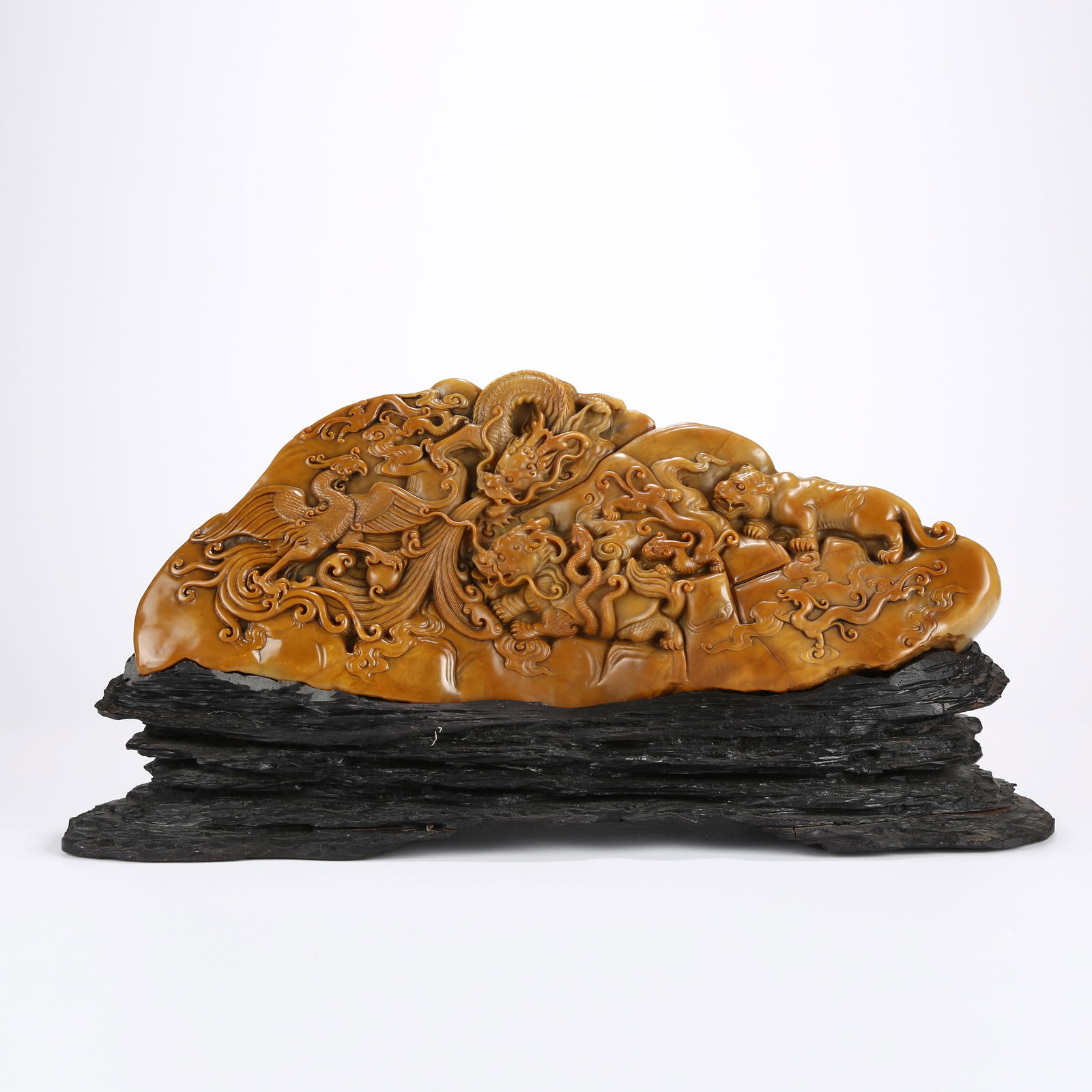 A SHOUSHAN TIANHUANG STONE MOUNTAIN SCULPTURE WITH FOUR ELEPHANTS DESIGN: Shoushan Tianhuang Stone Mountain Sculpture with Four Elephants Design