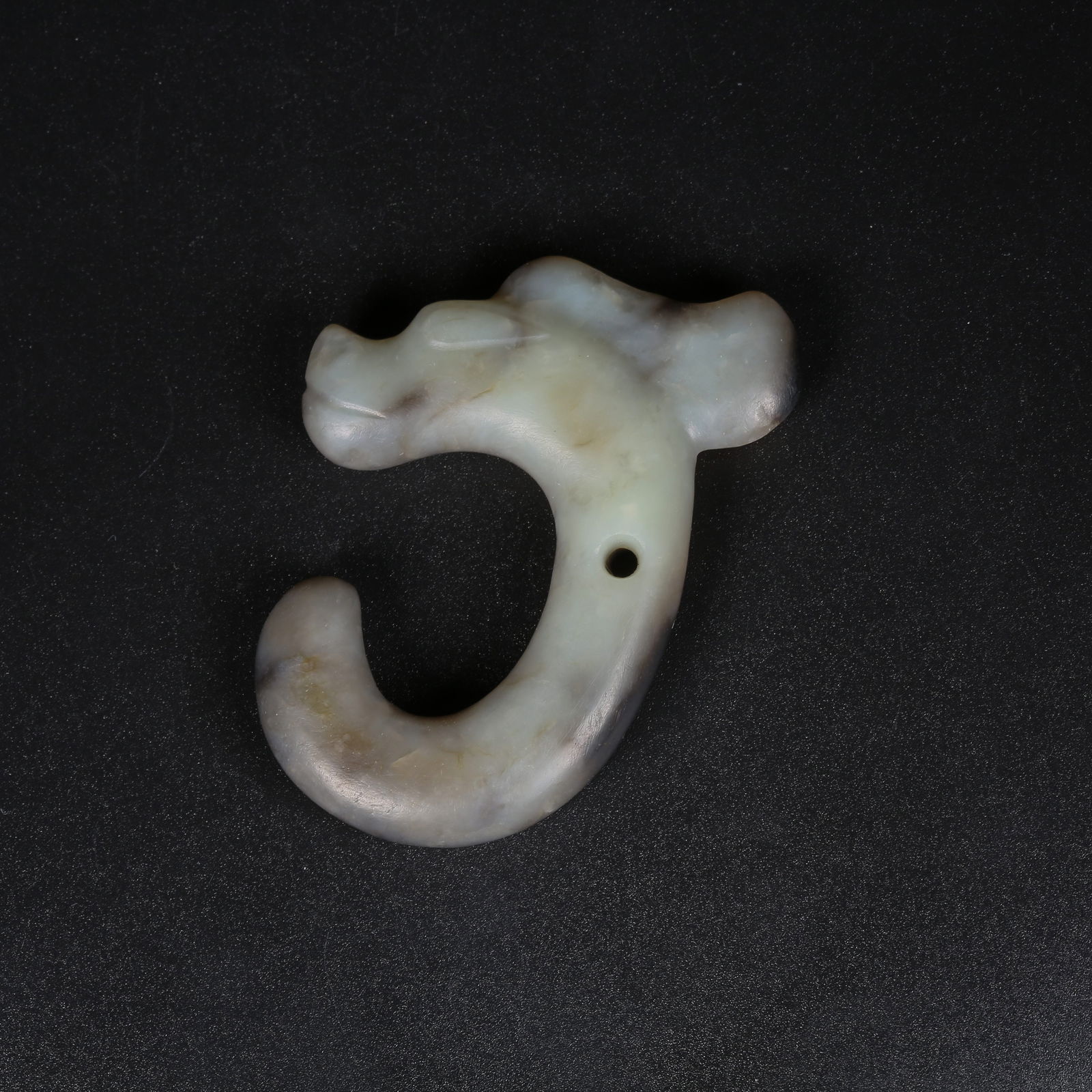 A ARCHAIC JADE C-SHAPED DRAGON PENDANT (1 of 9)