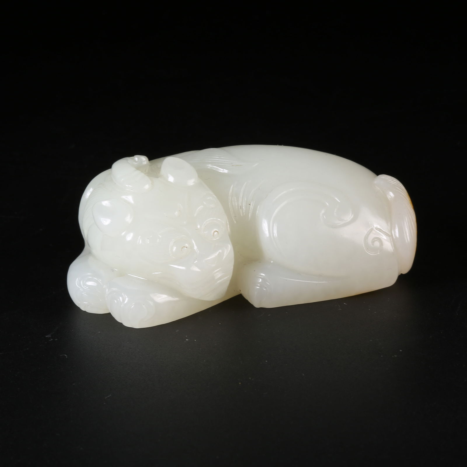 A HETIAN JADE AUSPICIOUS BEAST ORNAMENT (1 of 8)
