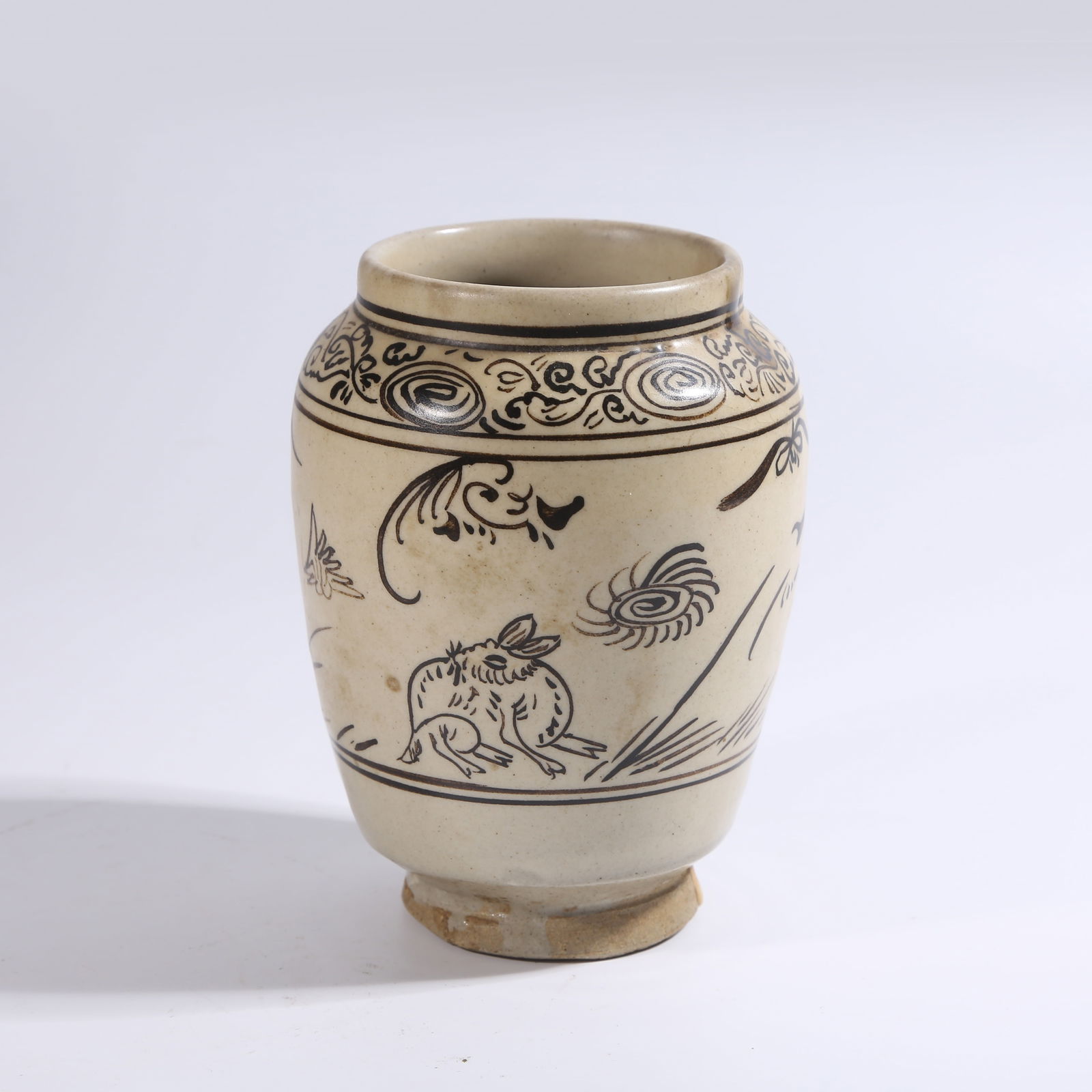 A CIZHOU KILN JAR WITH WHITE BACKGROUND AND BLACK FLOWER-AND-BIRD PATTERN (1 of 9)