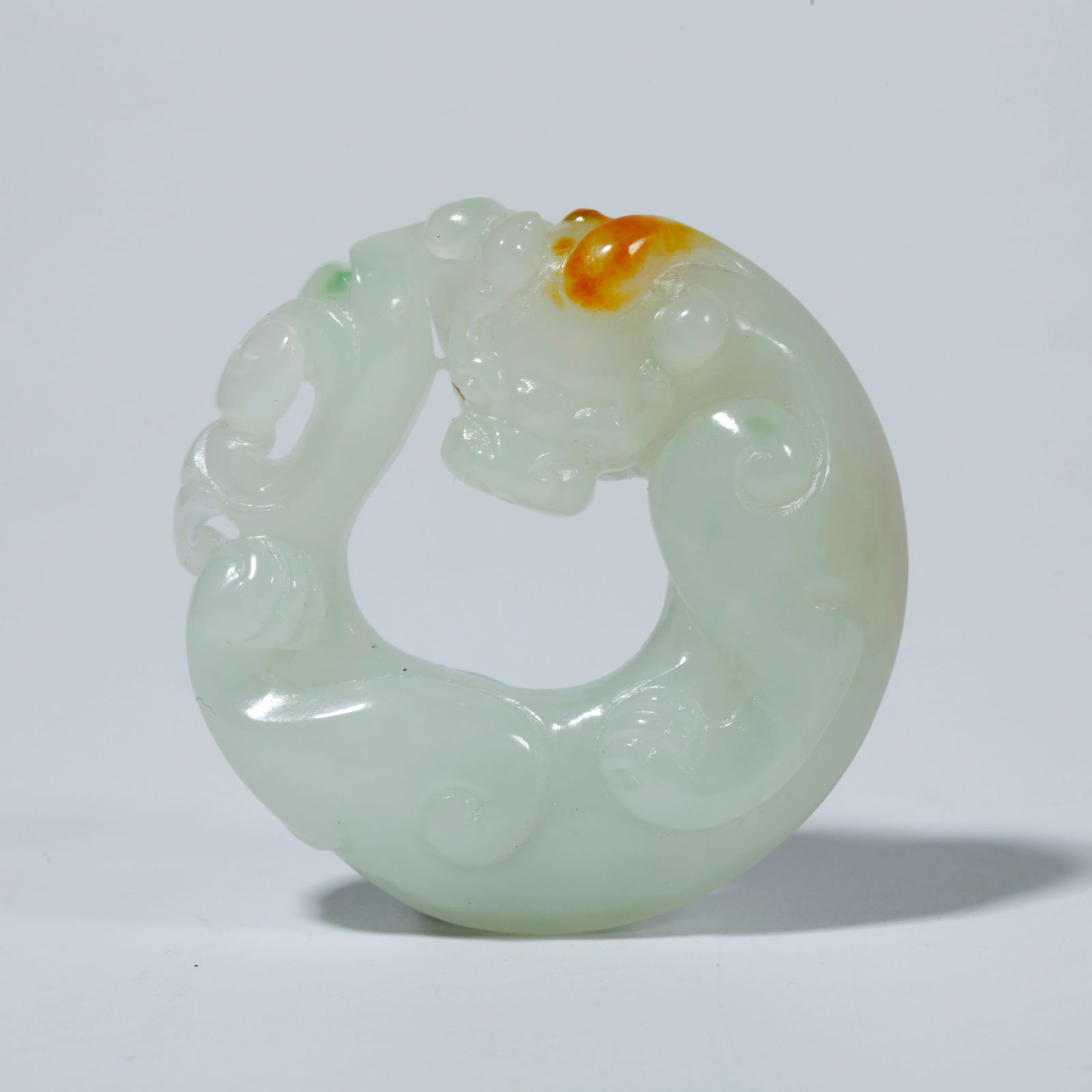 A HETIAN JADE TIGER-SHAPED PENDANT: Hetian Jade Tiger-Shaped Pendant