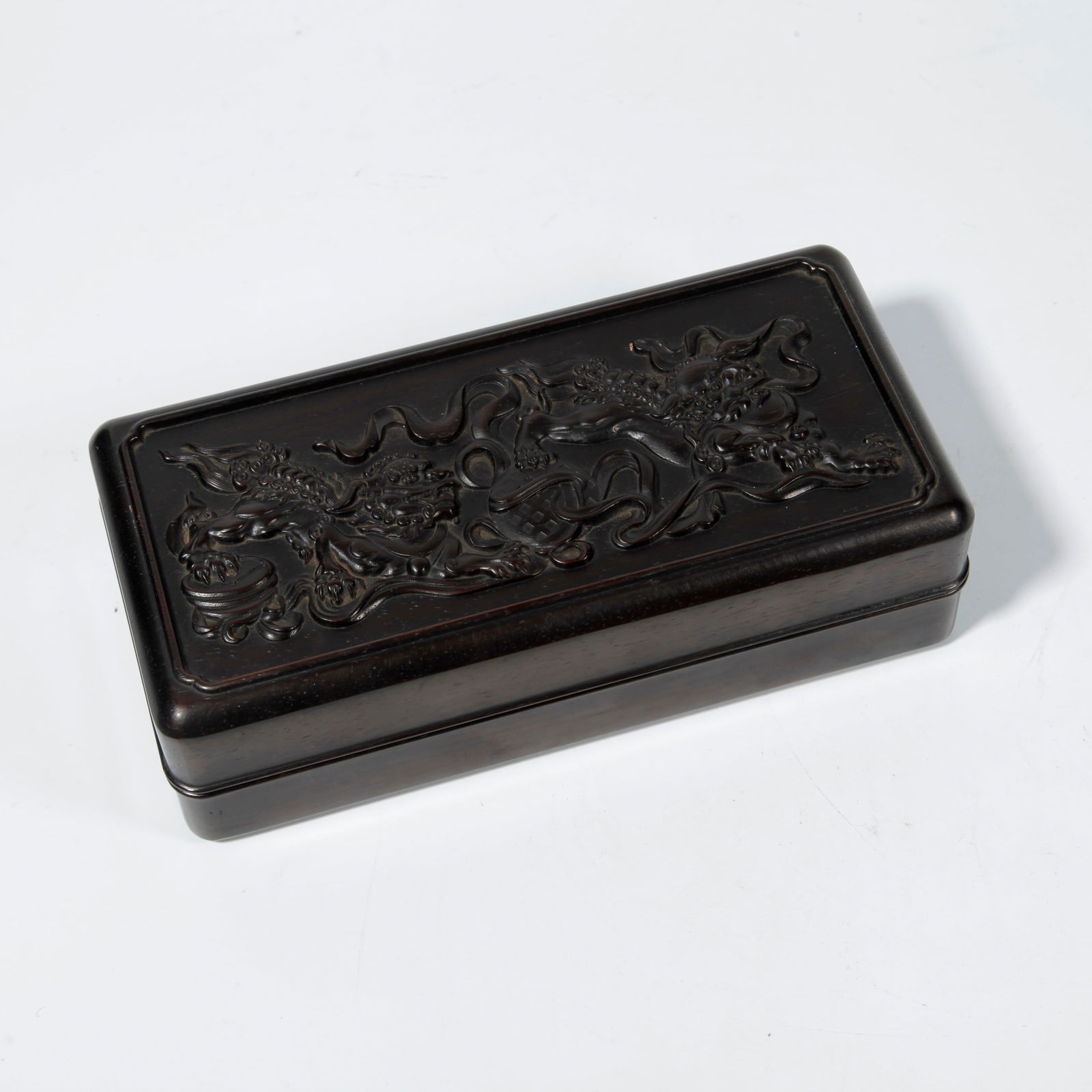 A ZITAN WOOD BOX WITH LION PLAYING WITH EMBROIDERED BALL CARVING: Zitan Wood Box with Lion Playing with Embroidered Ball Carving