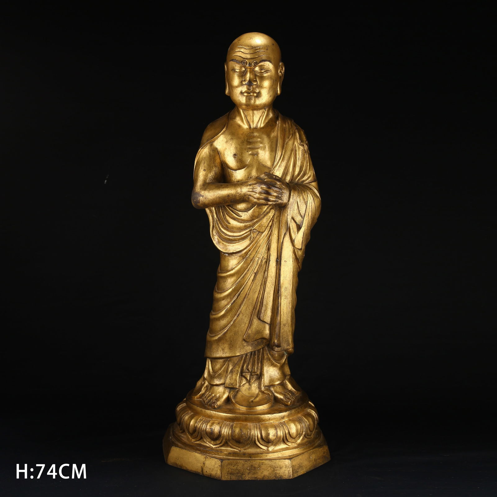A GILT BRONZE STANDING STATUE OF ELDER KASSAPA: Gilt Bronze Standing Statue of Elder Kassapa