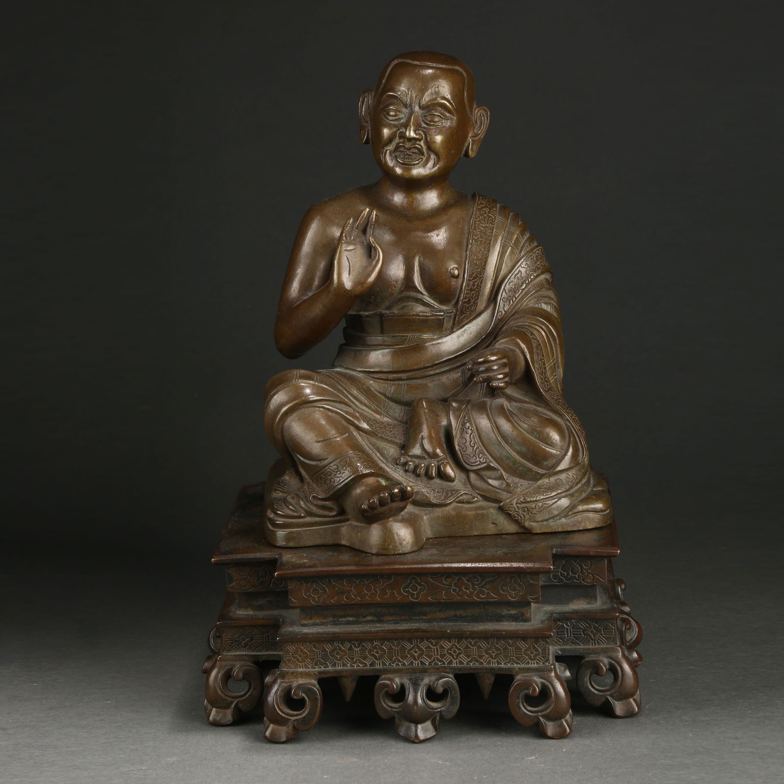 A BRONZE ARHAT STATUE (1 of 9)