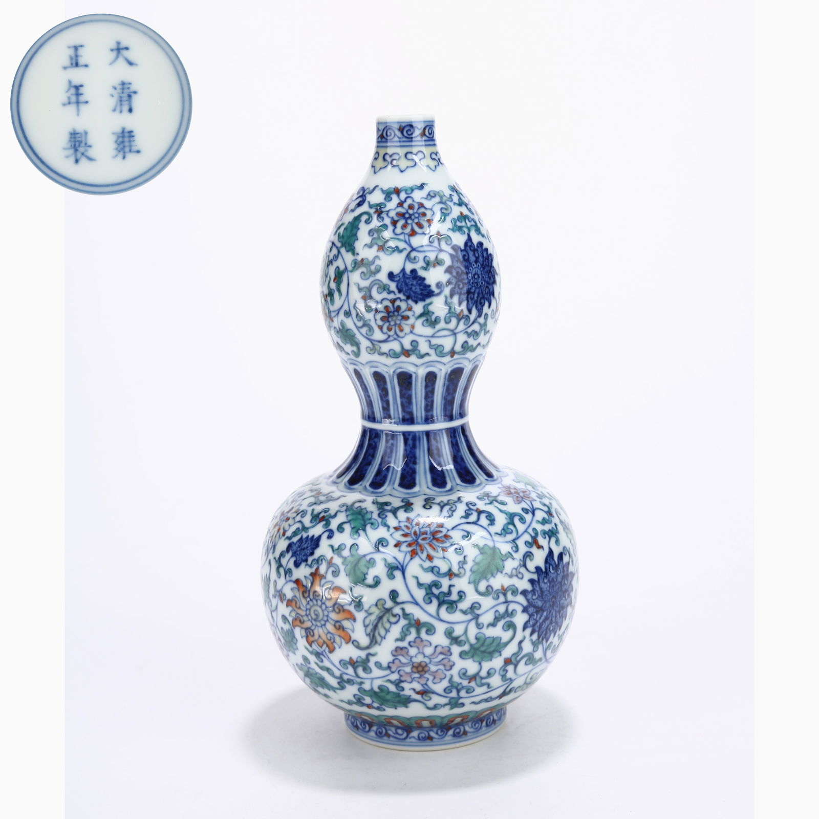 A DOUCAI GOURD VASE WITH SCROLLING FLORAL MOTIF: Doucai Gourd Vase with Scrolling Floral Motif