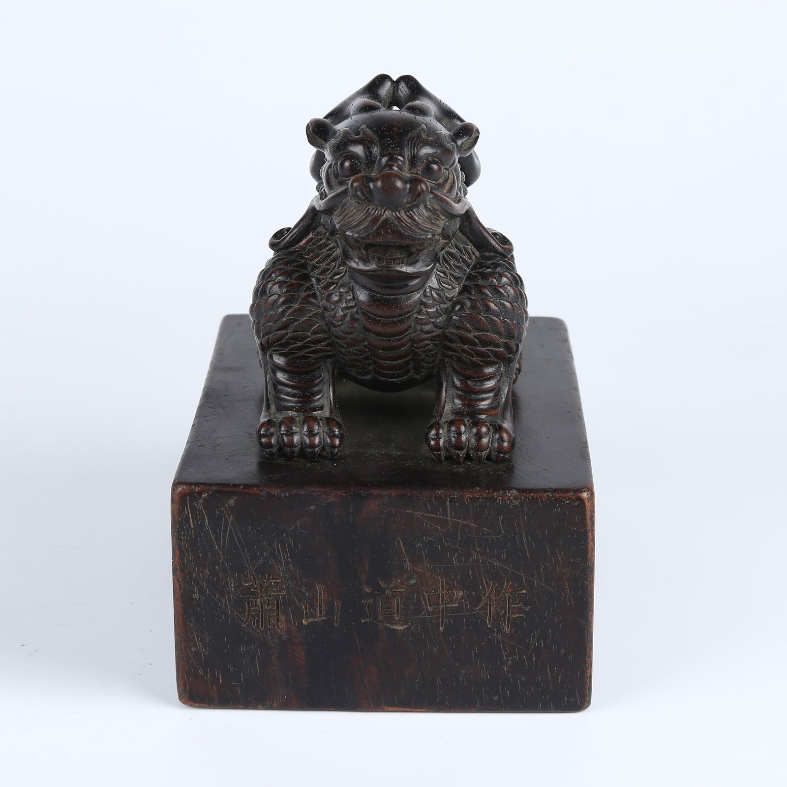 A ROSEWOOD CARVED QILIN KNOB SEAL (1 of 12)