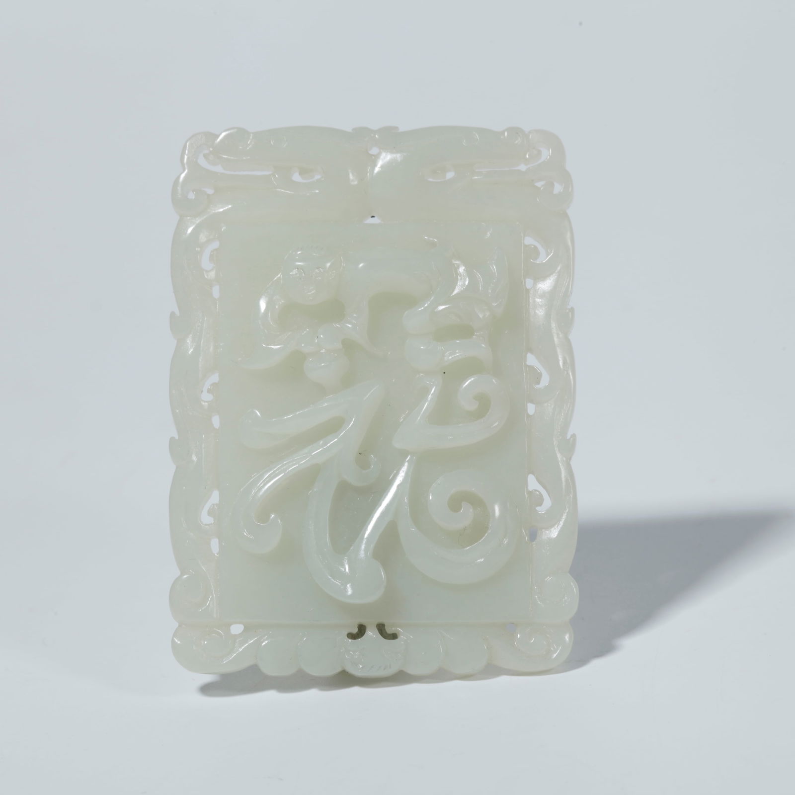 A HETIAN JADE PLAQUE WITH CHILD MOTIF: Hetian Jade Plaque with Child Motif