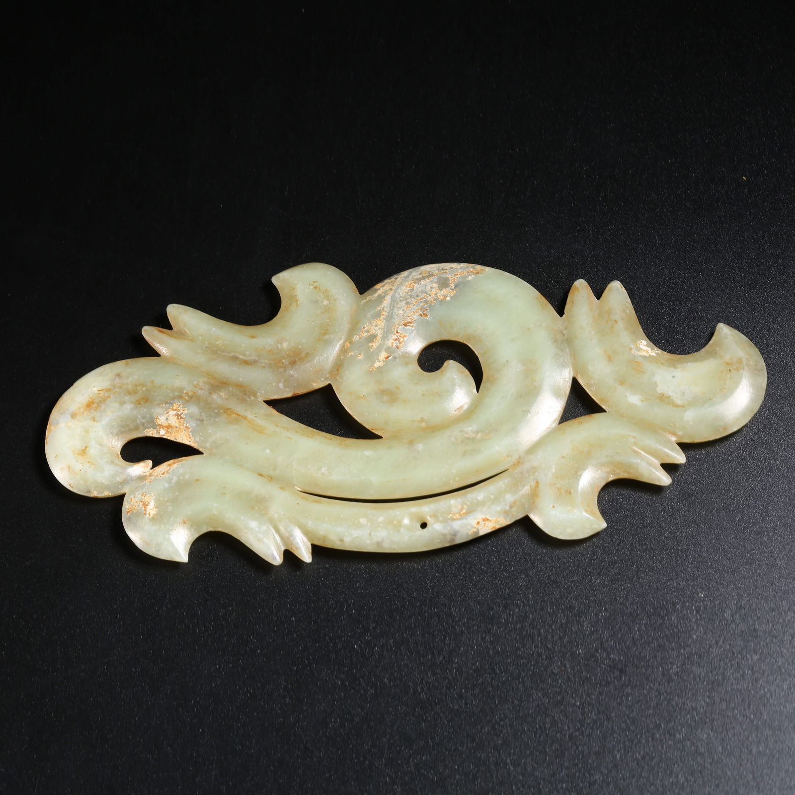 A ARCHAIC JADE PENDANT WITH HOOK-AND-CLOUD PATTERN (1 of 10)