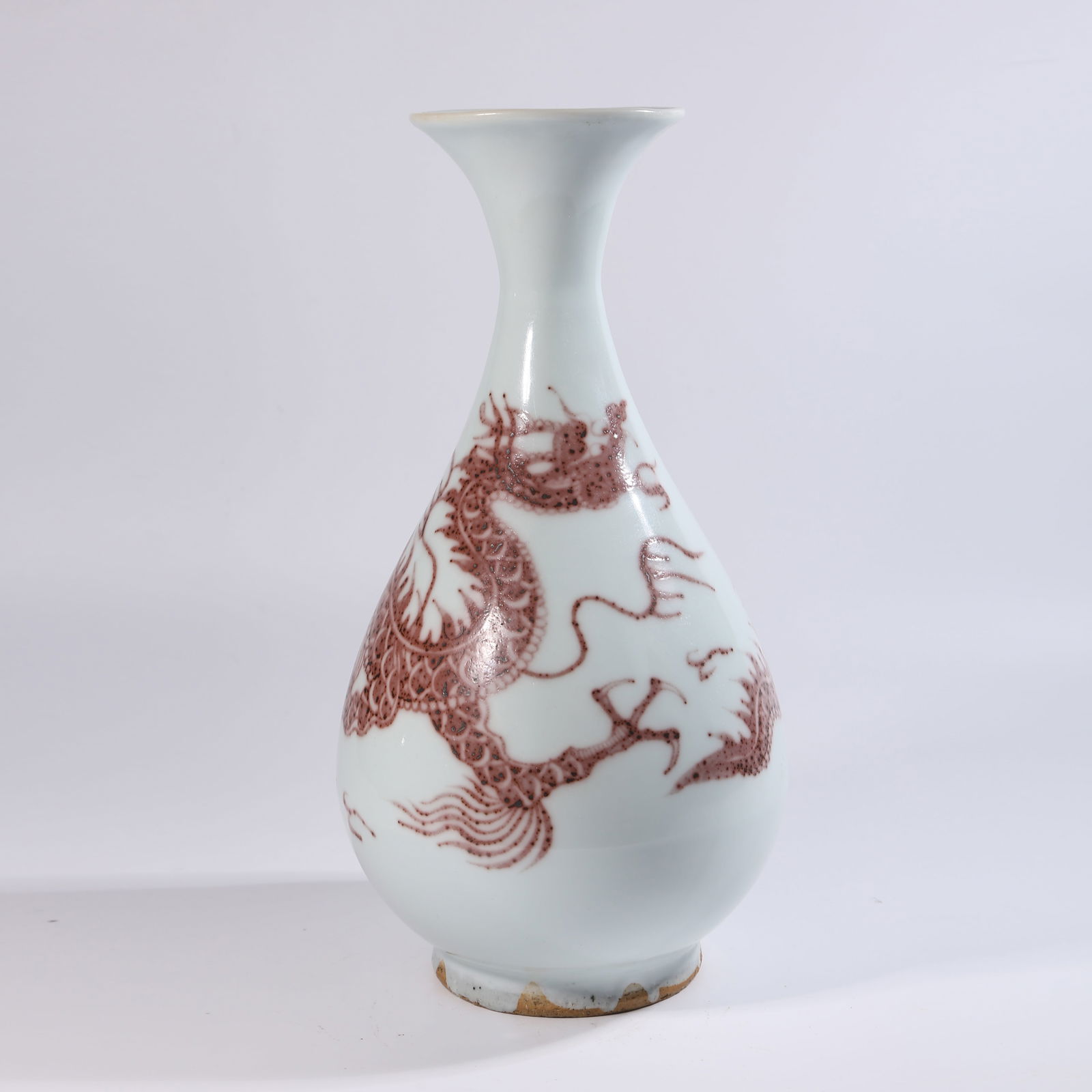 A UNDERGLAZE RED YUHUCHUN VASE WITH DRAGON PATTERN: Underglaze Red Yuhuchun Vase with Dragon Pattern