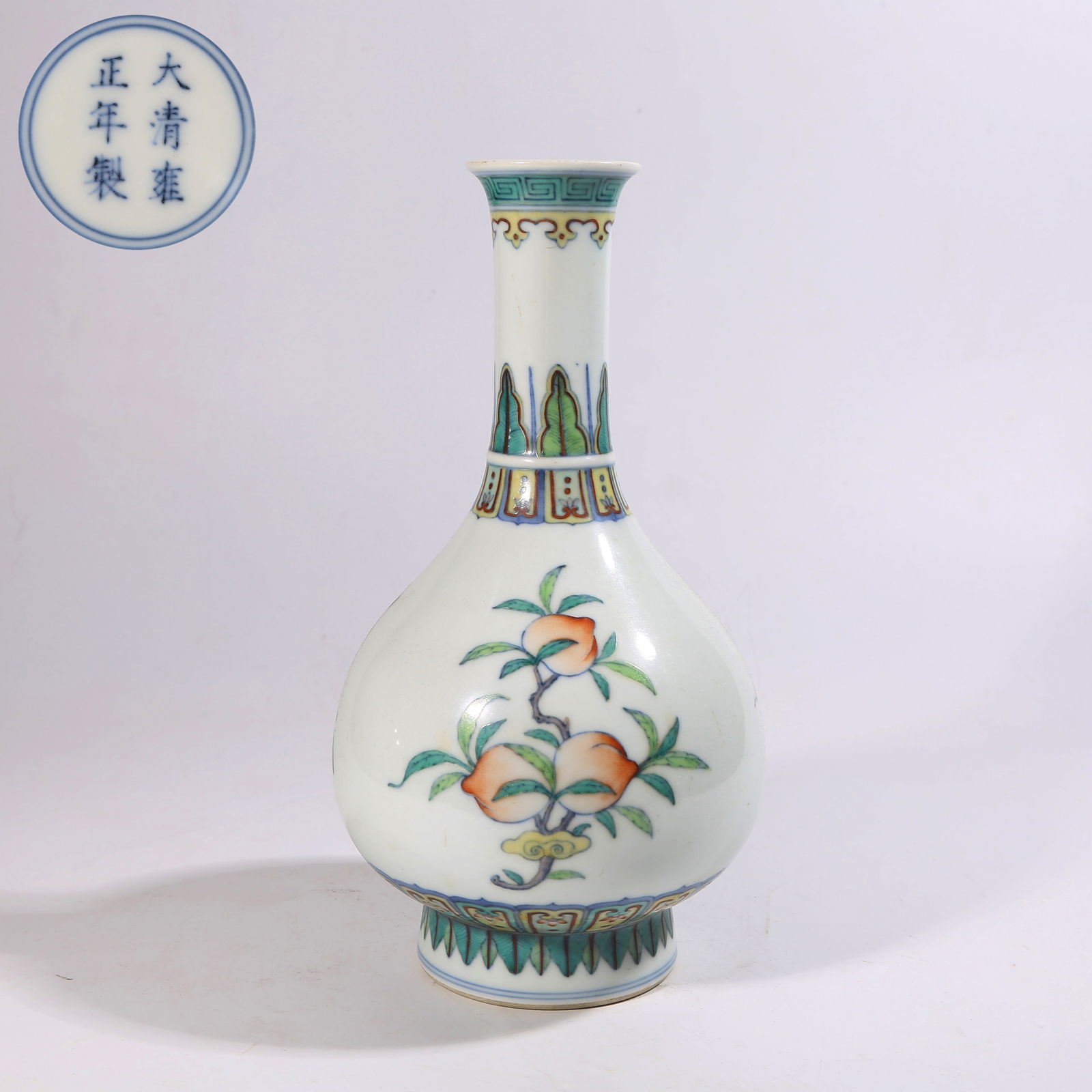 A DOUCAI LONG-NECK VASE WITH AUSPICIOUS FRUIT AND BROKEN-BRANCH MOTIF: Doucai Long-Neck Vase with Auspicious Fruit and Broken-Branch Motif