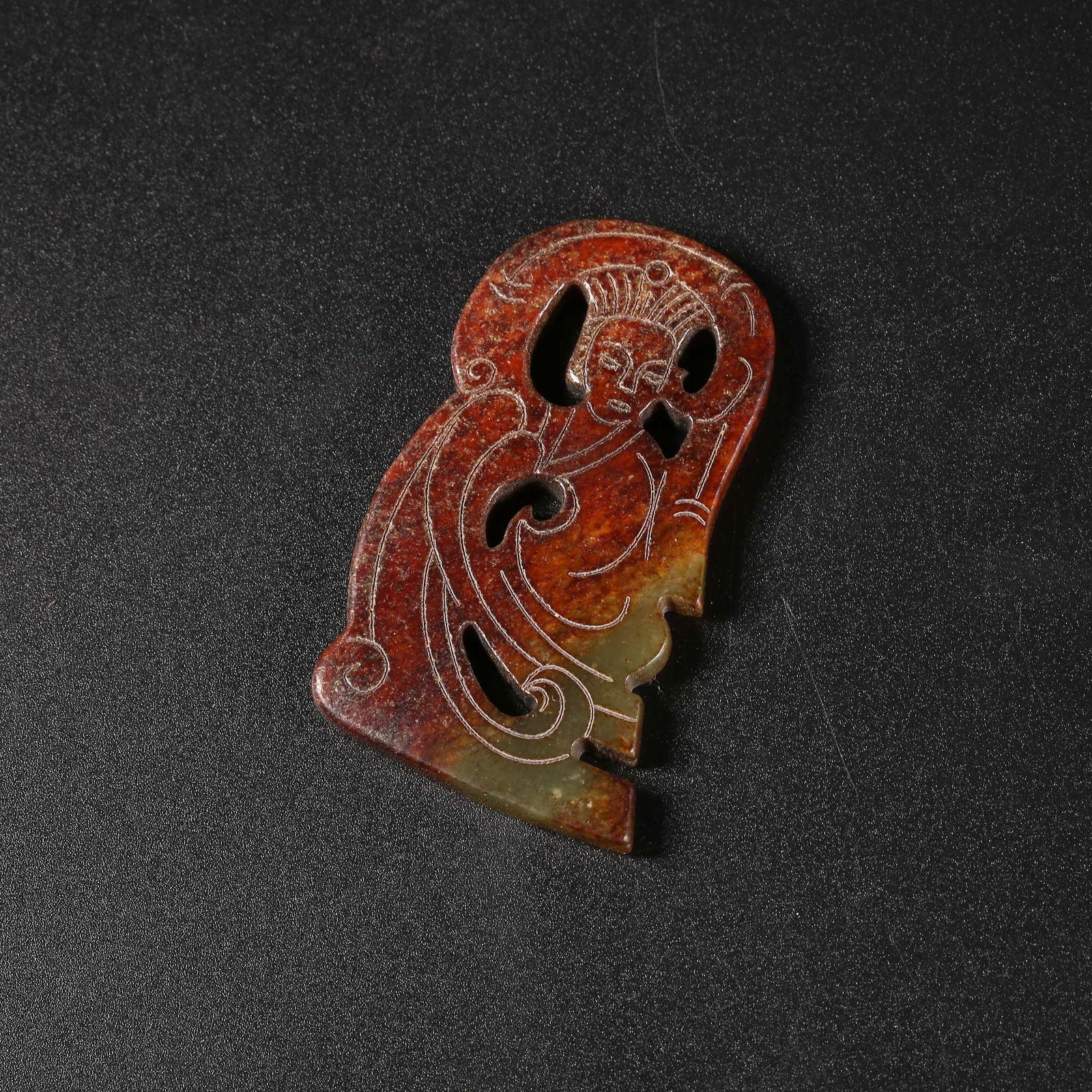 A MIDDLE-PERIOD JADE HUMAN FIGURE PENDANT (1 of 7)