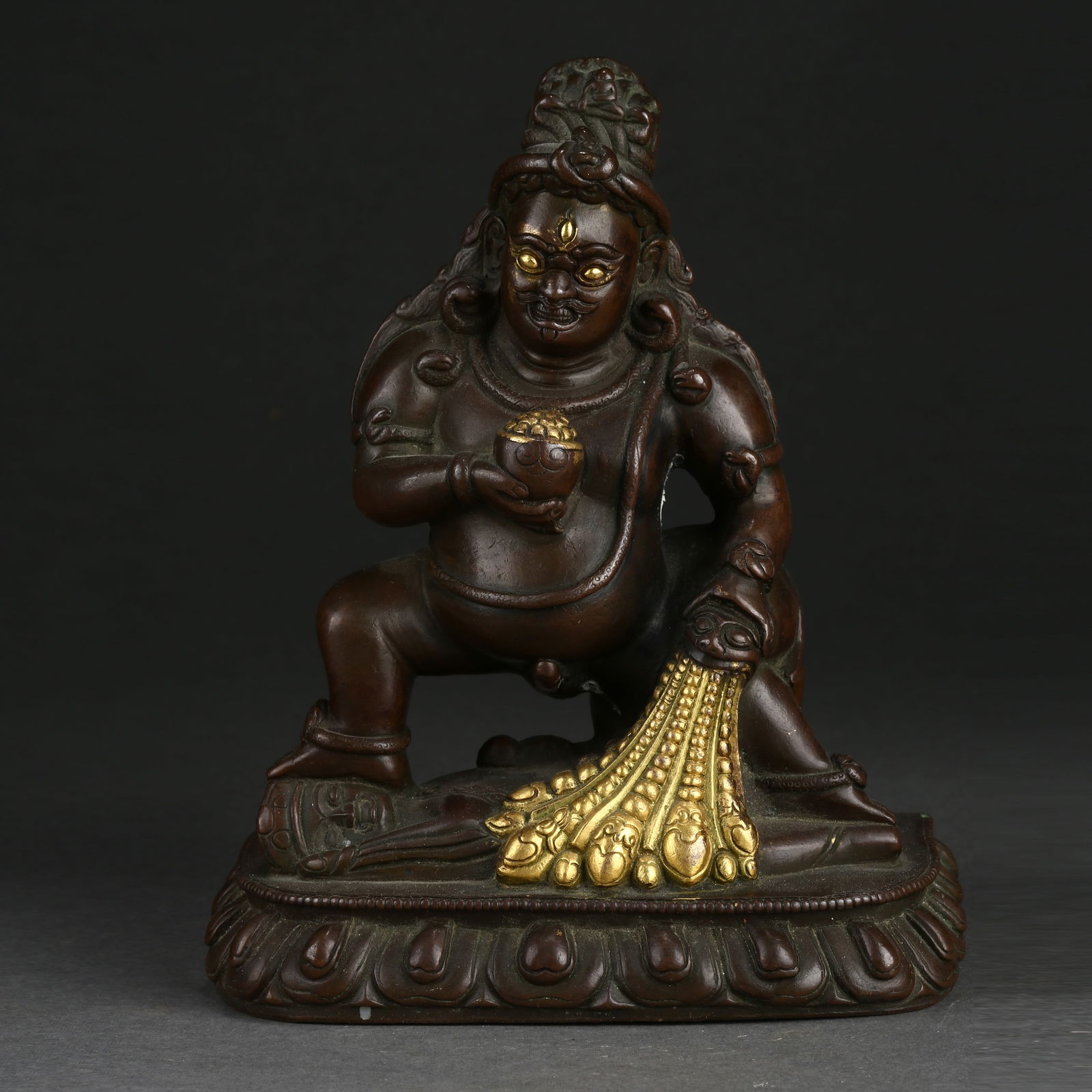A BRONZE BLACK JAMBHALA (WEALTH DEITY) STATUE (1 of 9)