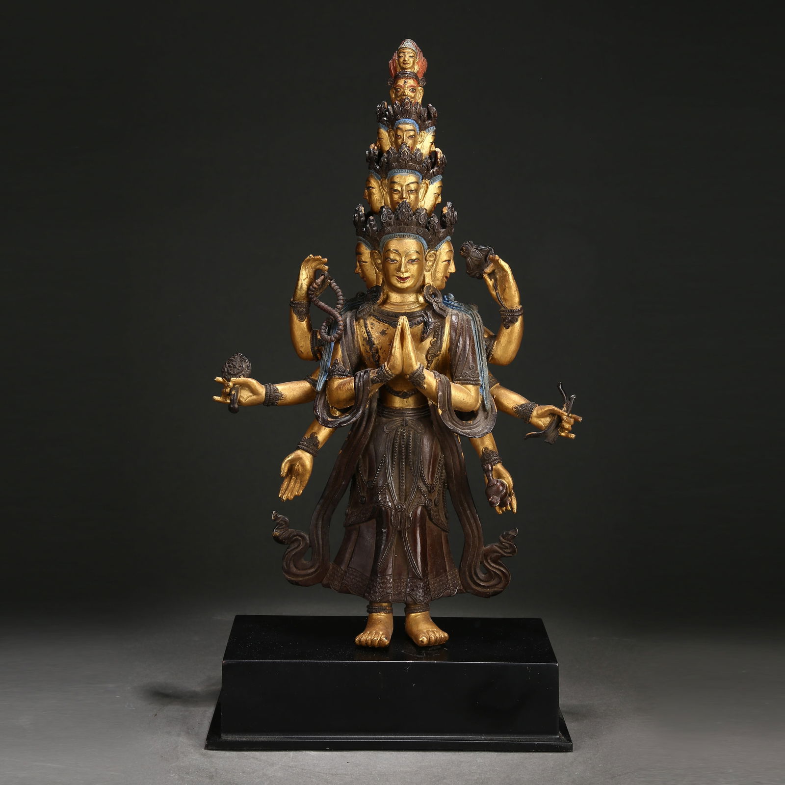 A GILDED BRONZE ELEVEN-FACED AVALOKITESHVARA IN THE SIX-TIERED PAGODA STYLE: Gilded Bronze Eleven-Faced Avalokiteshvara in the Six-Tiered Pagoda Style