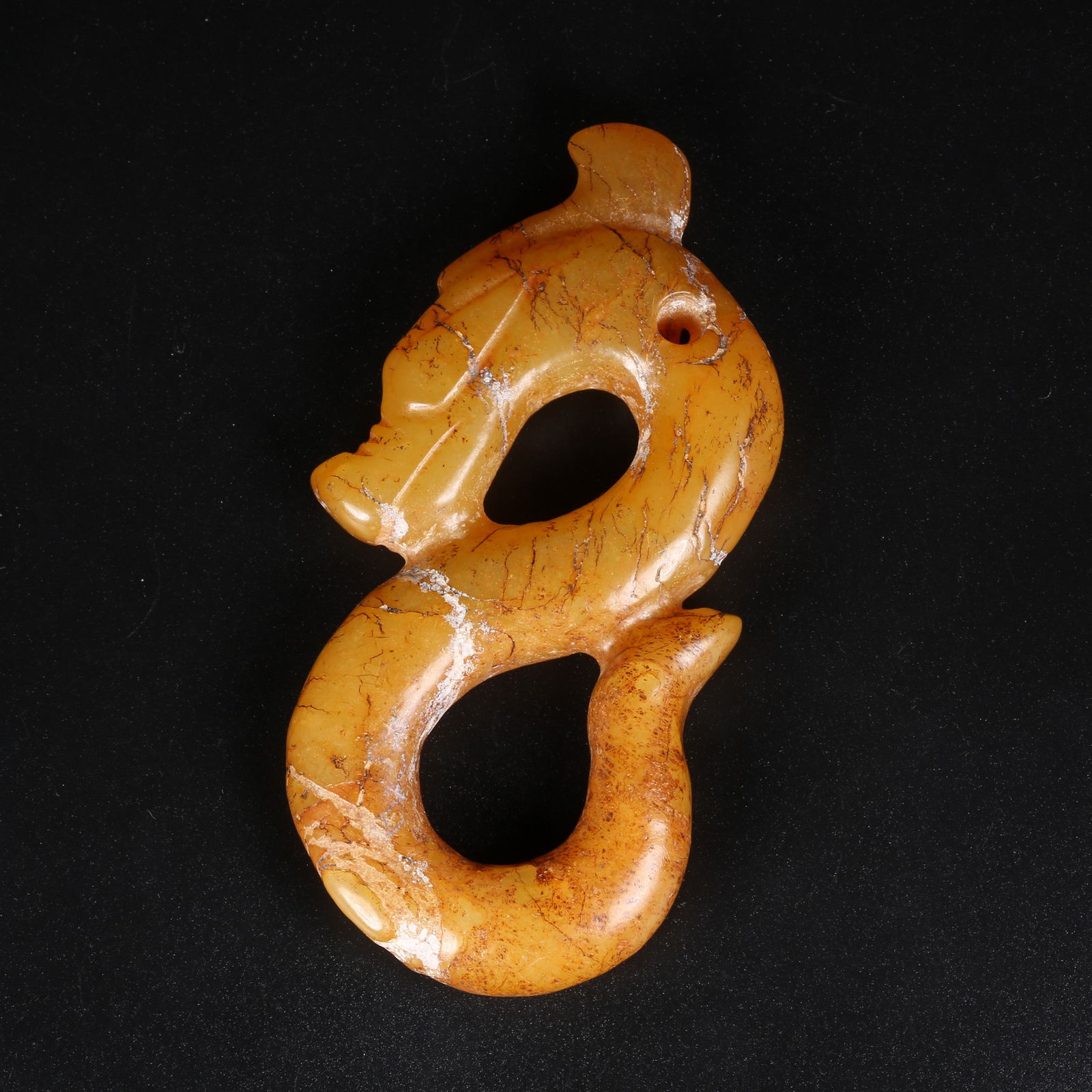 A ARCHAIC JADE S-SHAPED DRAGON PENDANT (1 of 9)