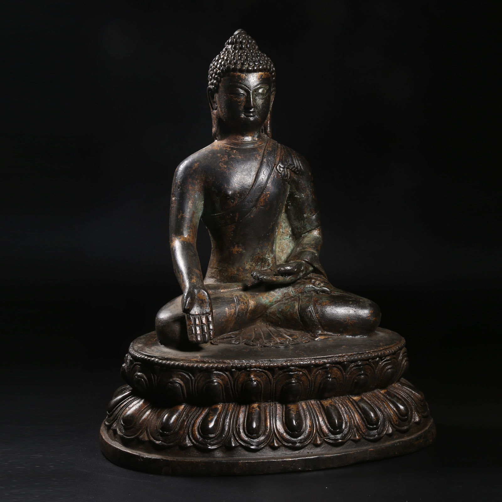 A GILT-BRONZE SEATED STATUE OF SHAKYAMUNI (1 of 8)