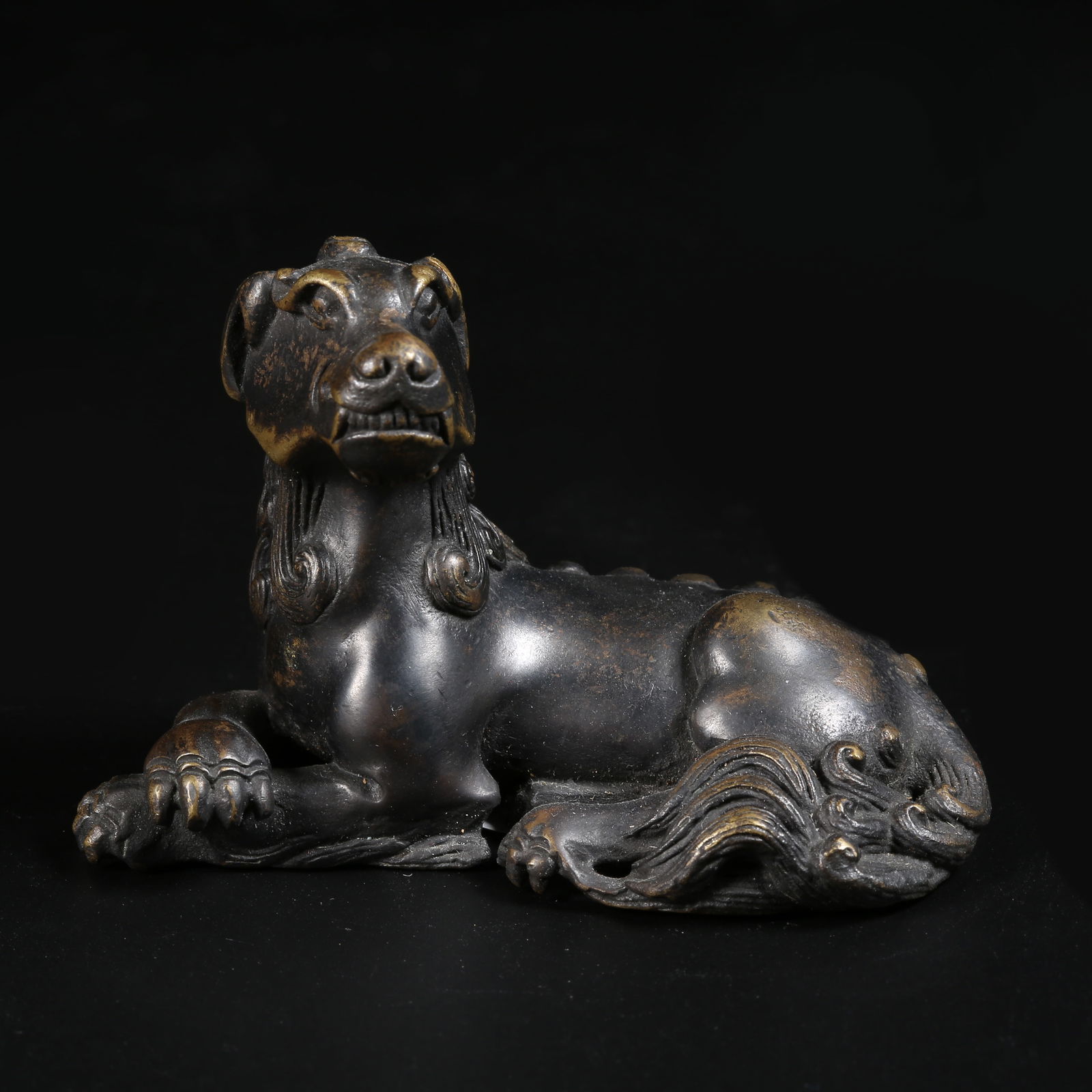 A GILT-BRONZE AUSPICIOUS BEAST ORNAMENT (1 of 8)
