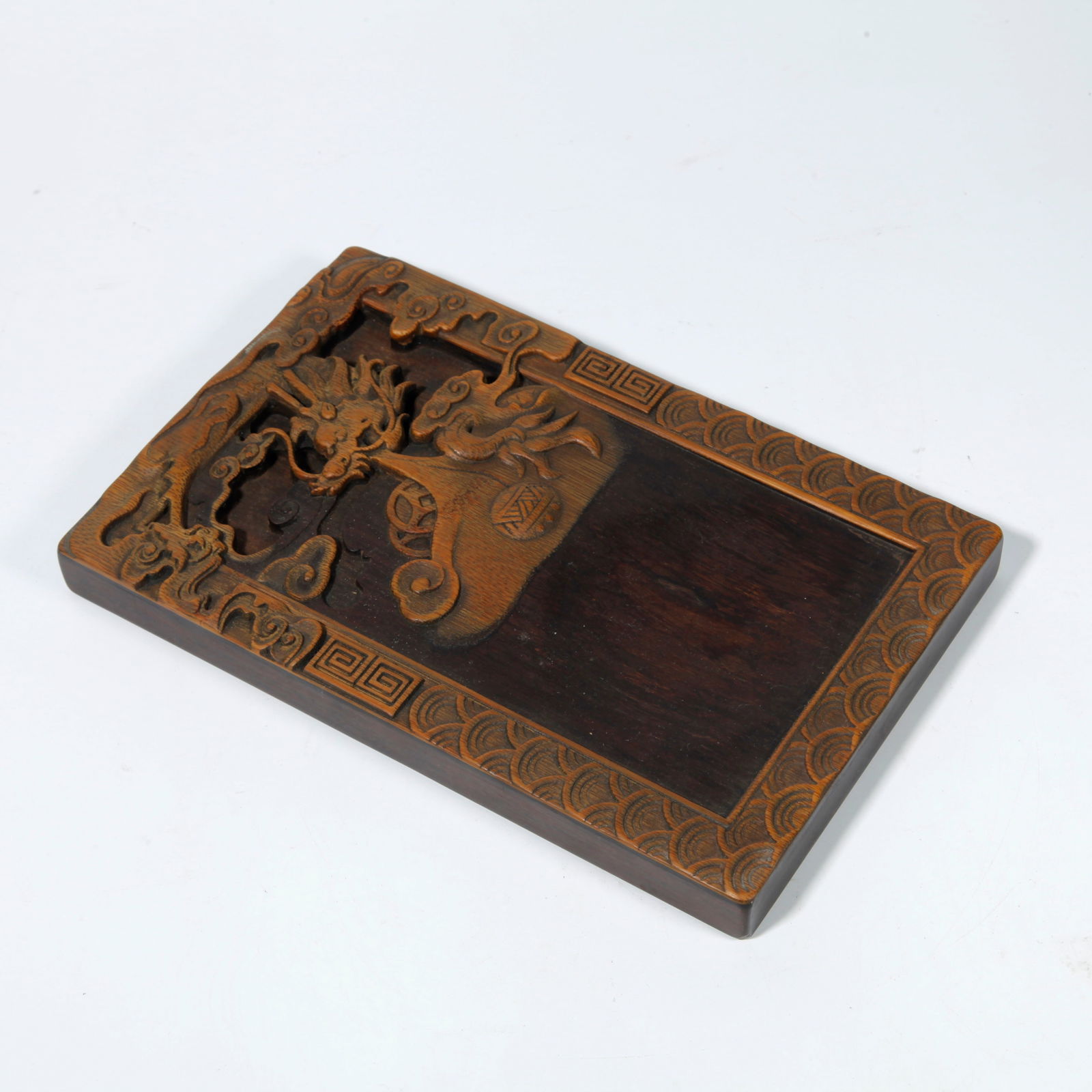 A HUANGHUALI WOOD INKSTONE BASE WITH CLOUD AND DRAGON CARVING (1 of 8)