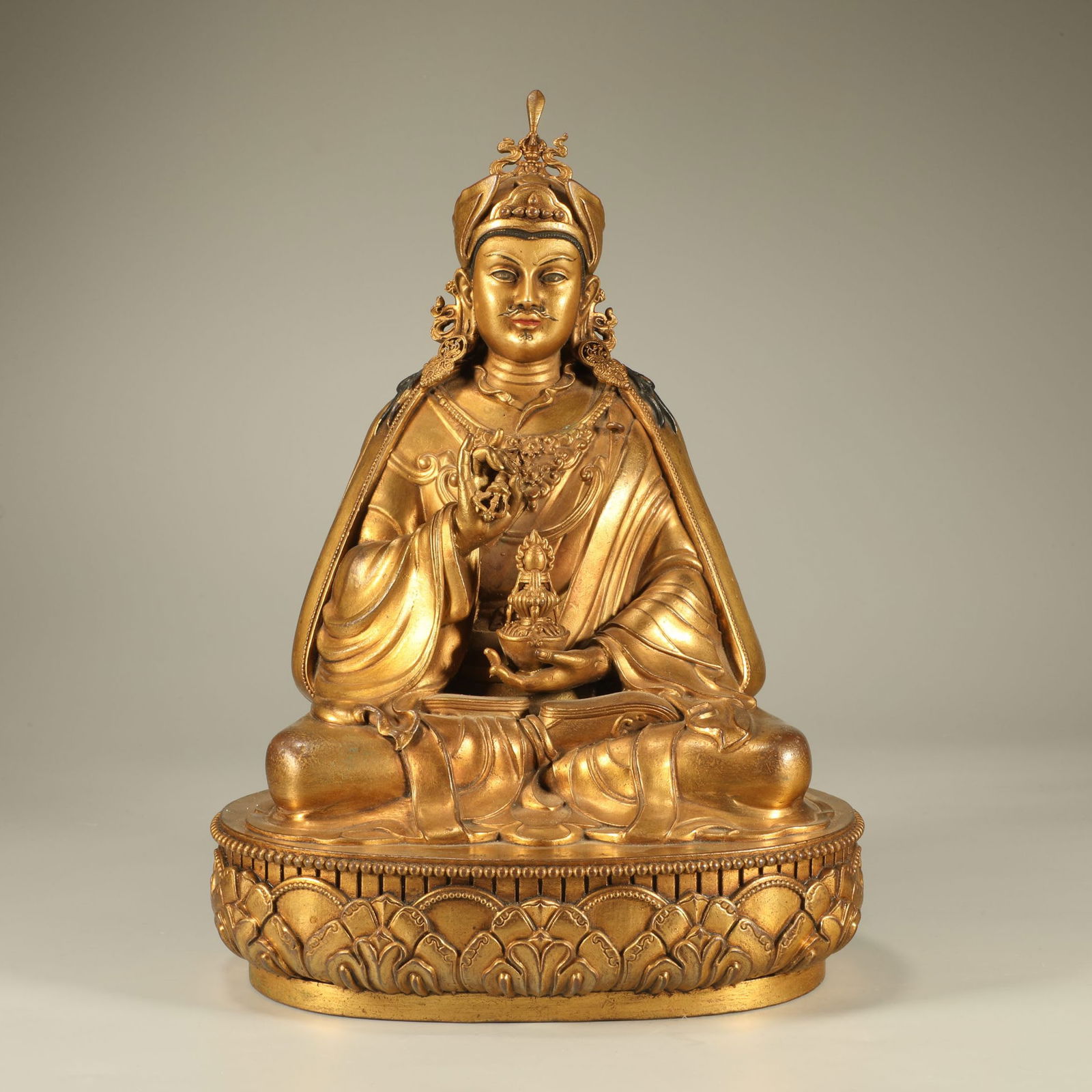 A GILT-BRONZE PADMASAMBHAVA FIGURE: Gilt-Bronze Padmasambhava Figure