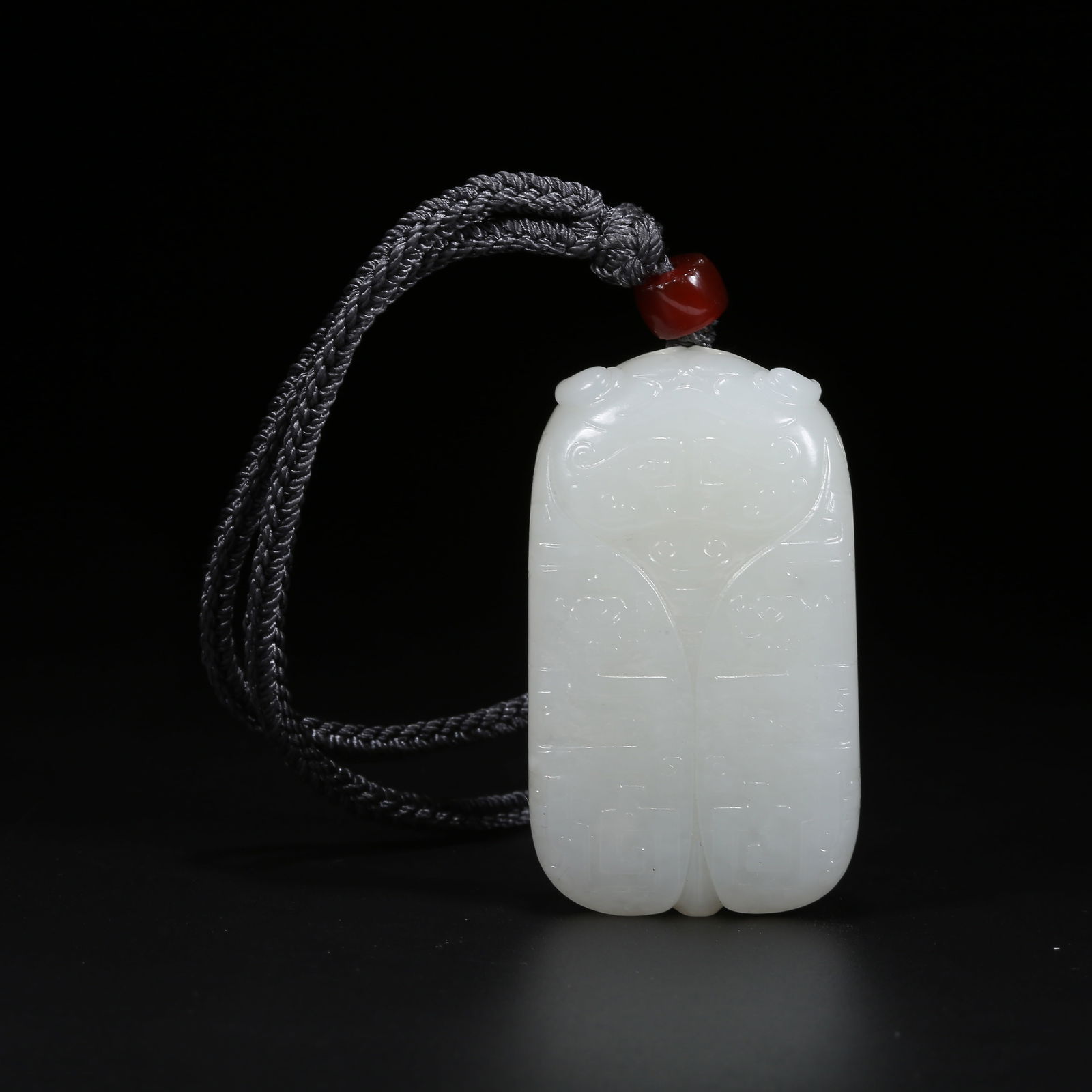 A HETIAN WHITE JADE CICADA-SHAPED PENDANT: Hetian White Jade Cicada-Shaped Pendant