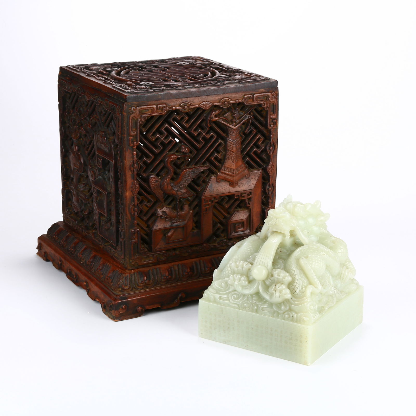 A LARGE HETIAN JADE SEAL WITH DRAGON-SHAPED KNOB AND HUANGHUALI SEAL BOX: Large Hetian jade seal with dragon-shaped knob and huanghuali seal box