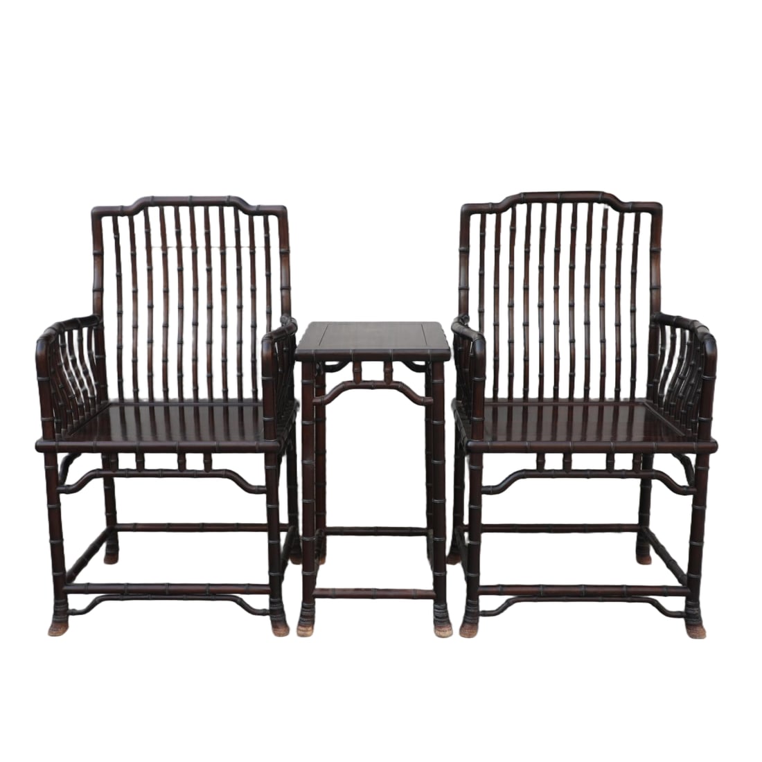 A SET OF THREE REDWOOD CARVED BAMBOO-PATTERNED COMB-BACK CHAIRS: Set of three redwood carved bamboo-patterned comb-back chairs