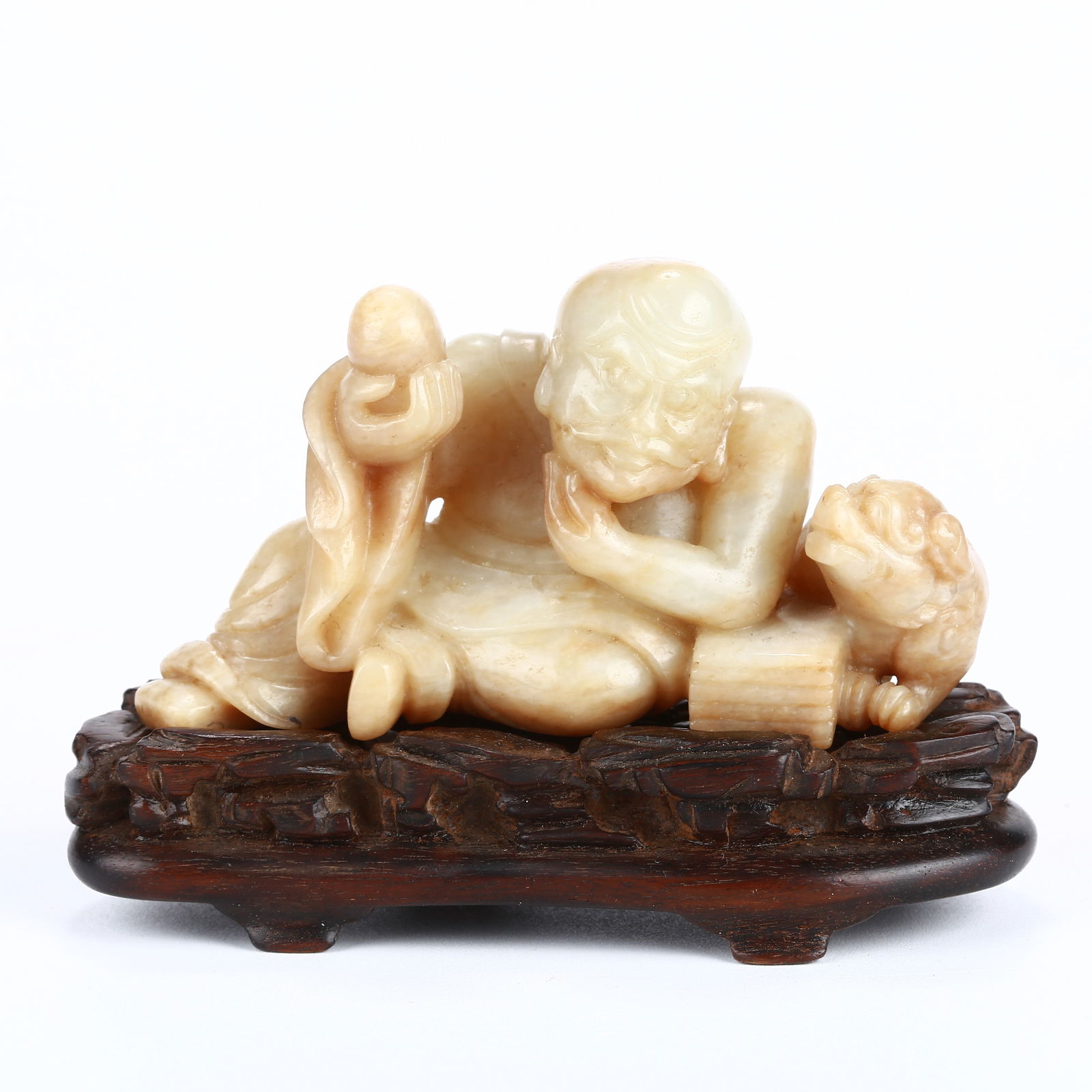 A HETIAN JADE ARHAT FIGURINE: Hetian jade arhat figurine