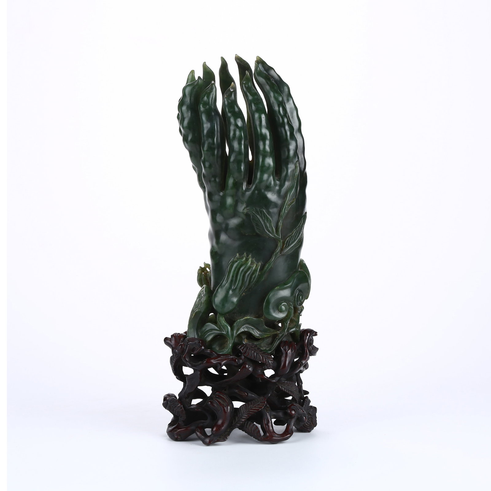 A HETIAN GREEN JADE LARGE FLOWER VASE SHAPED LIKE A BUDDHA'S HAND: Hetian green jade large flower vase shaped like a Buddha's hand