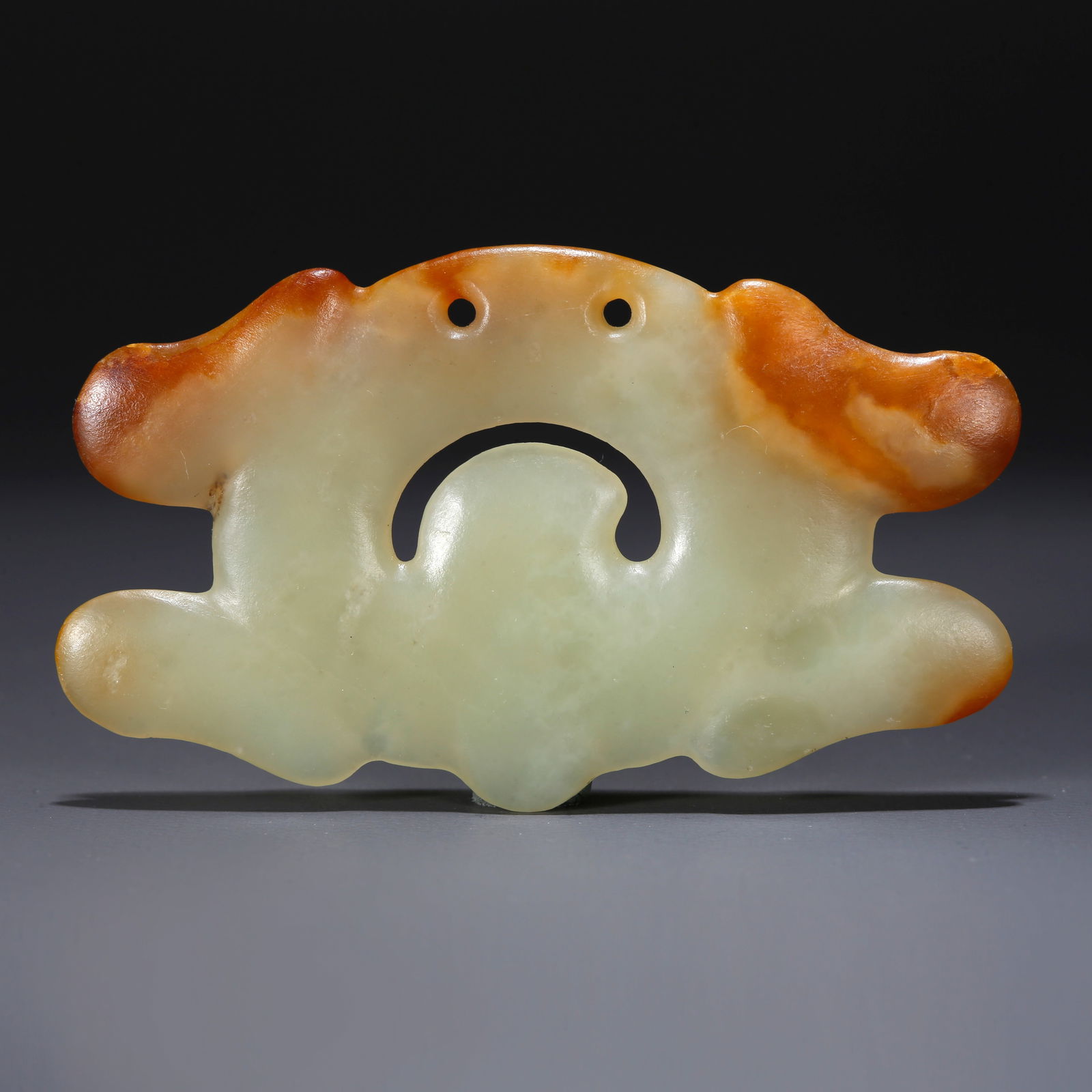 A HETIAN JADE CARVED CLOUD HOOK PENDANT: Hetian Jade Carved Cloud Hook Pendant