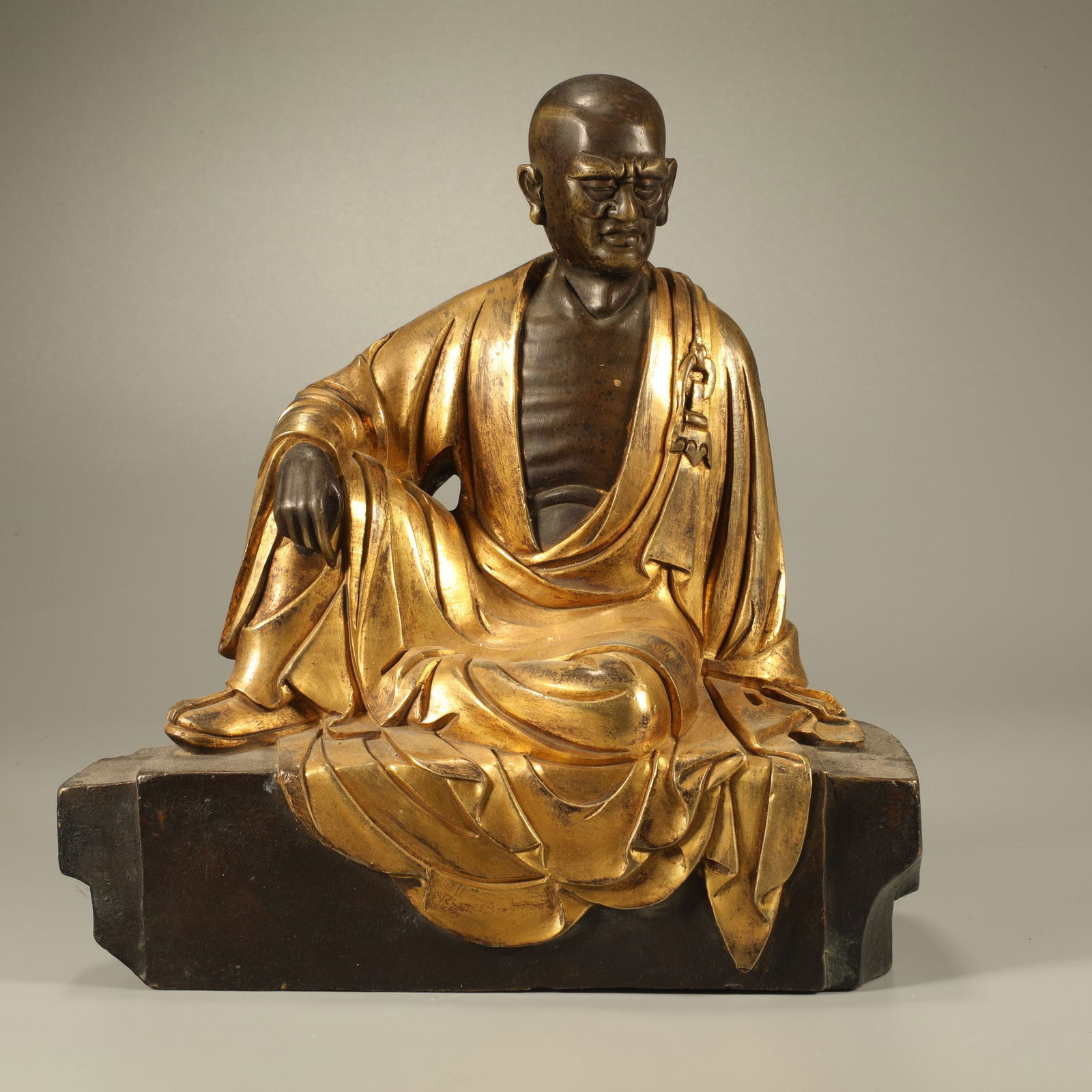 A GILT BRONZE ARHAT STATUE: Gilt bronze Arhat statue