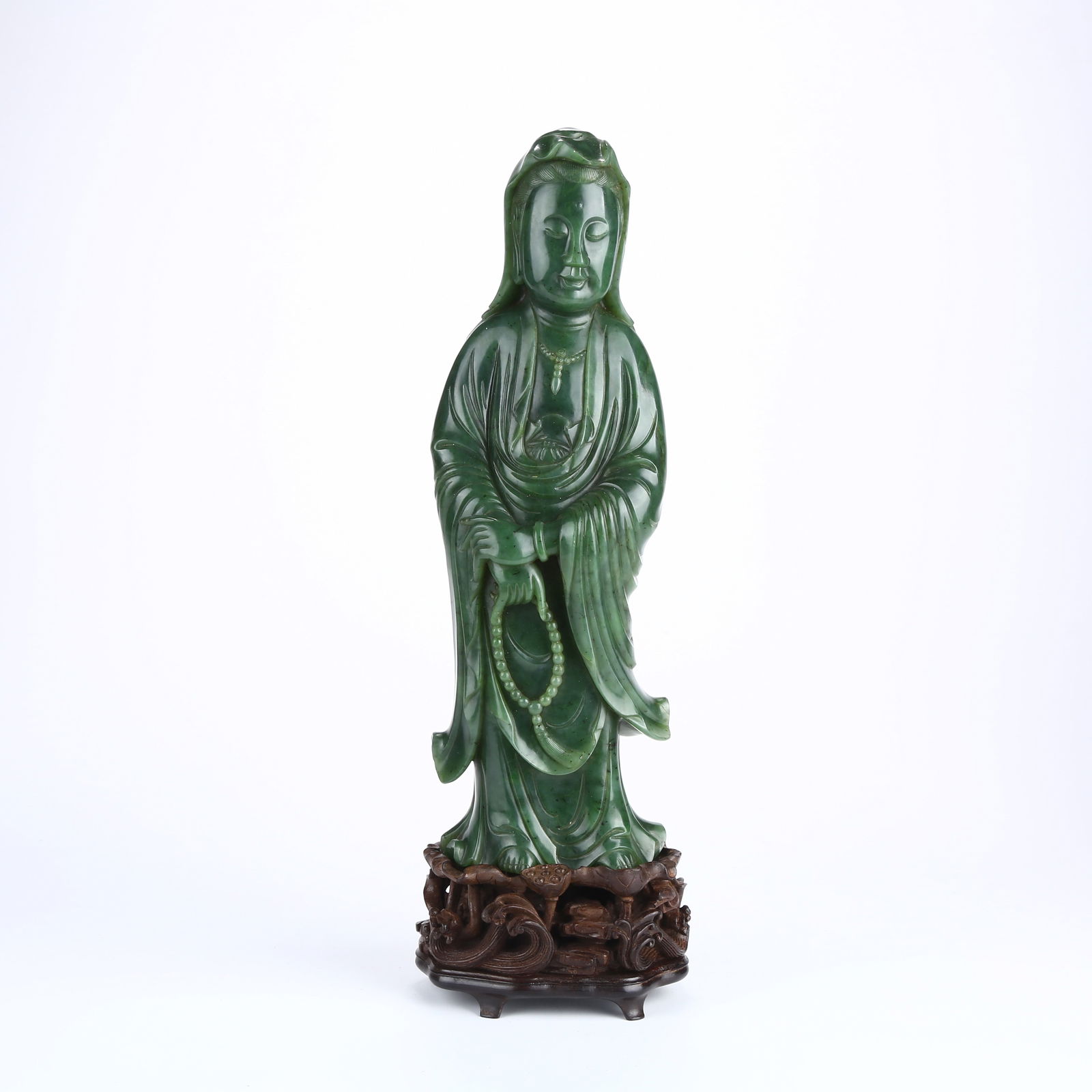 A HETIAN GREEN JADE FIGURE OF GUANYIN BODHISATTVA (1 of 9)