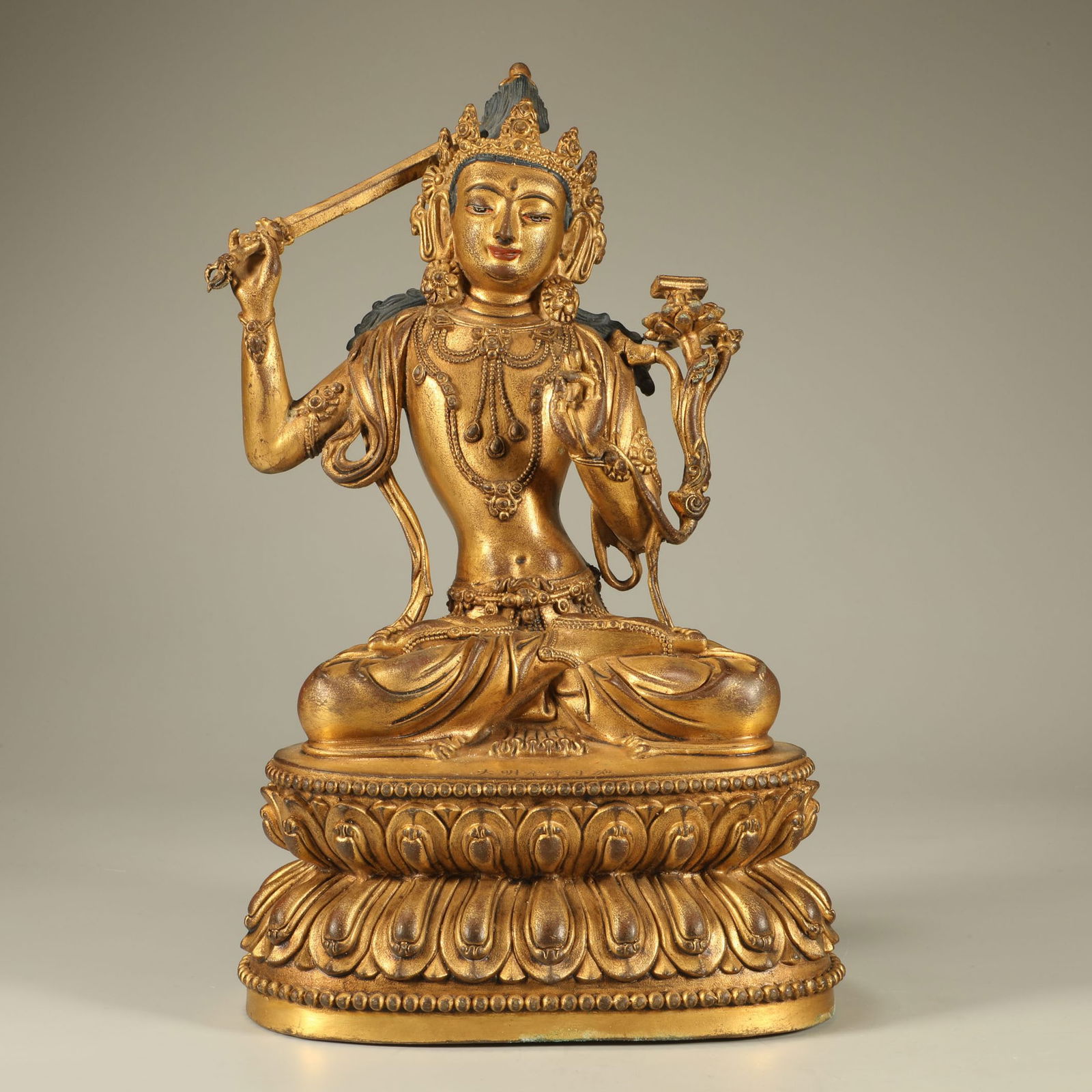 A GILT-BRONZE MANJUSHRI BODHISATTVA FIGURE (1 of 6)