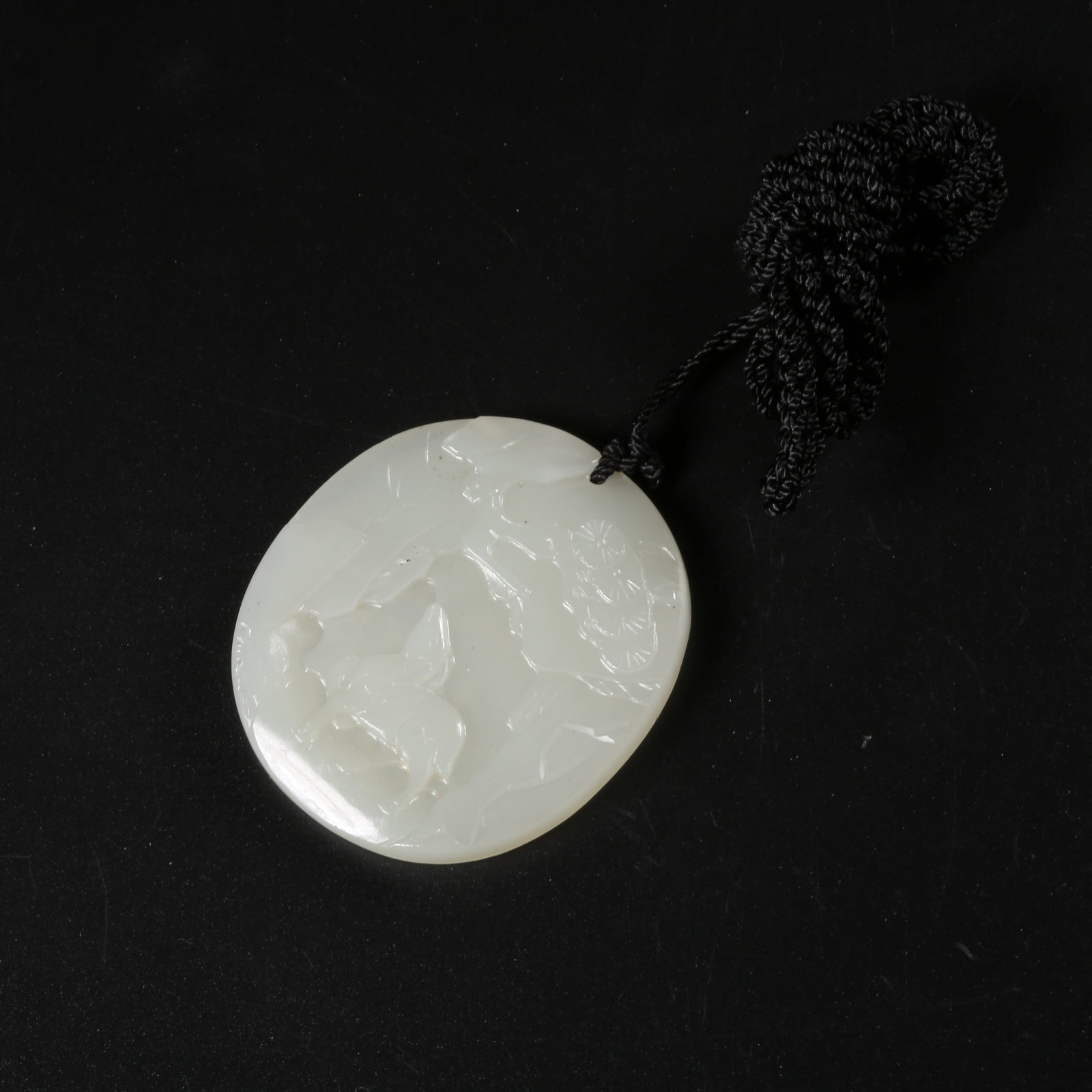 A HETIAN WHITE JADE PINE-AND-DEER MOTIF PLAQUE (1 of 6)