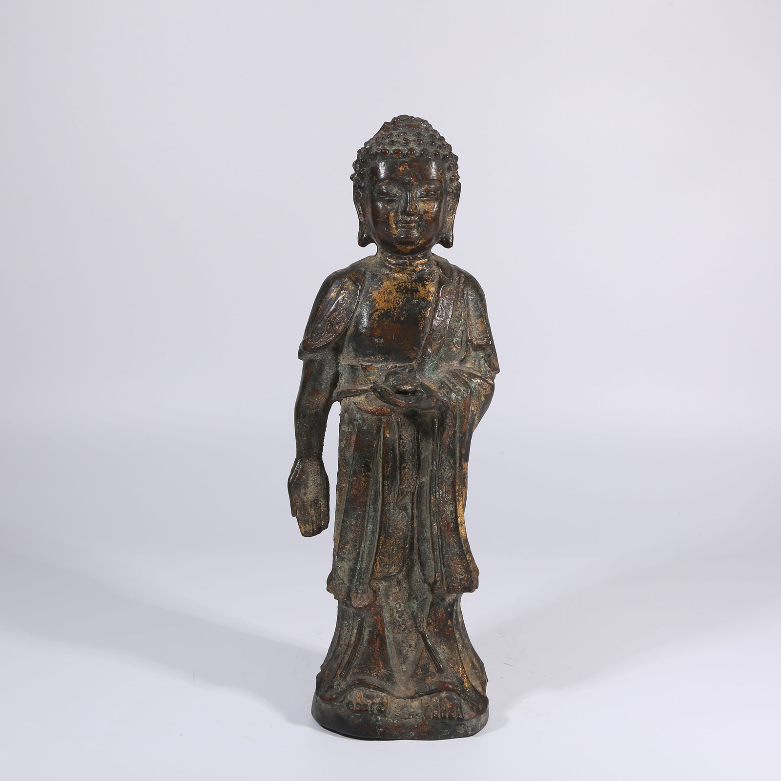 A GILT BRONZE STANDING VAIROCANA BUDDHA (1 of 10)