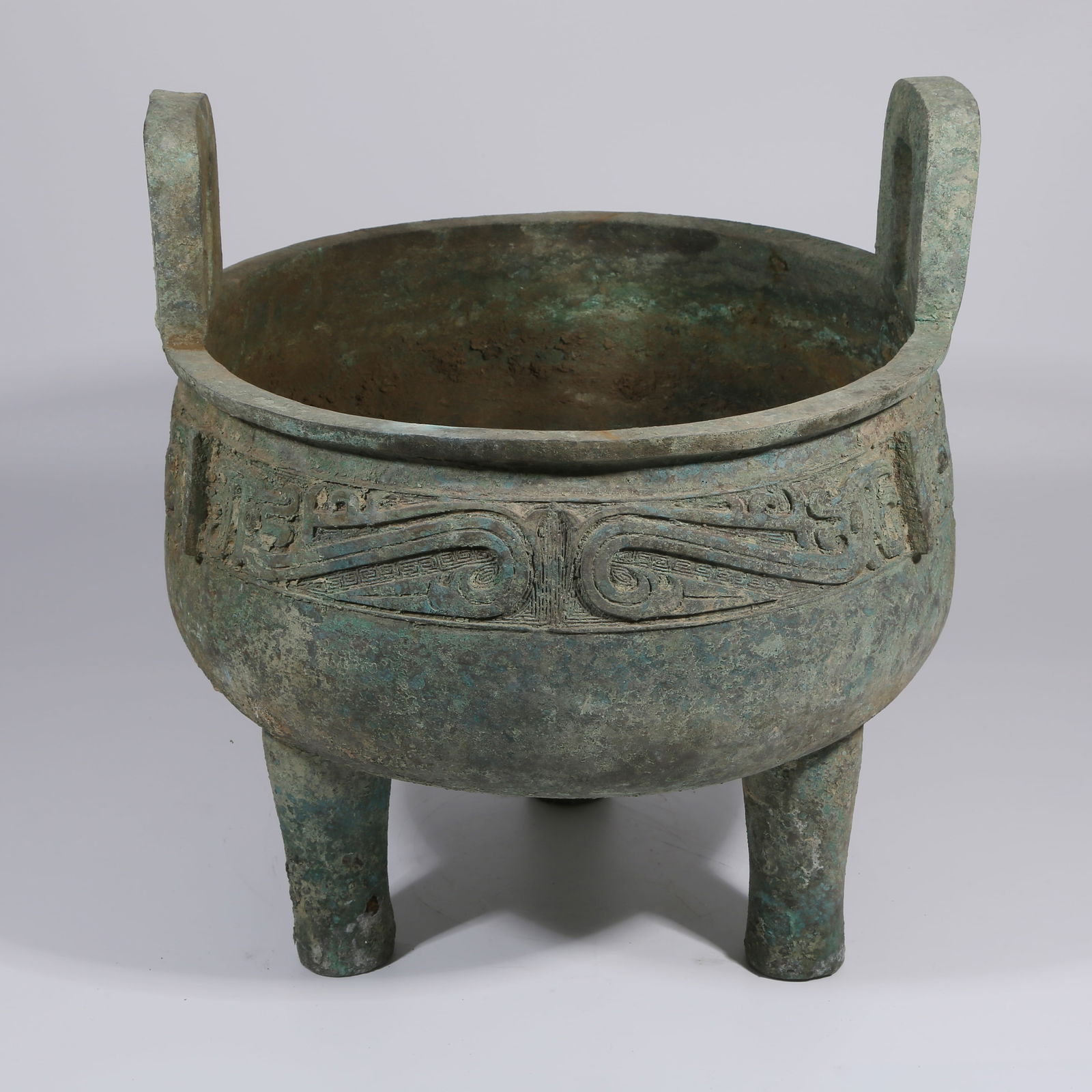A BRONZE TRIPOD CENSER WITH TAOTIE MASK MOTIF (1 of 9)