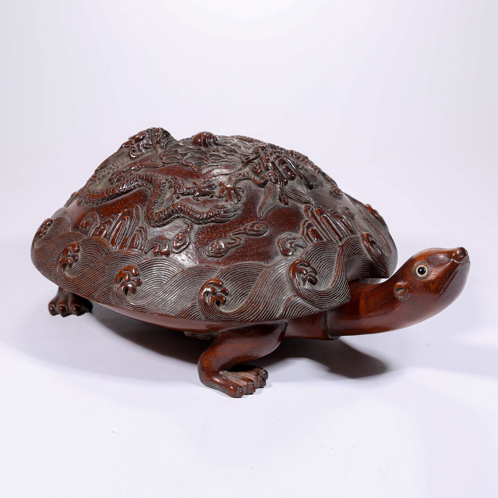 A HUANGHUALI WOOD INCENSE BURNER WITH CLIFF AND SEA DRAGON PATTERN AND LONGEVITY TURTLE: Huanghuali Wood Incense Burner with Cliff and Sea Dragon Pattern and Longevity Turtle