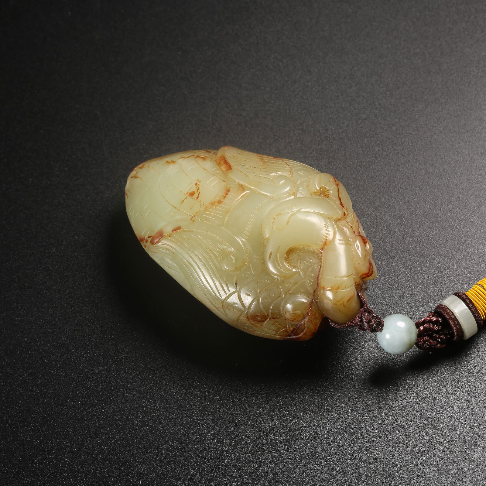 A HETIAN JADE PHOENIX-SHAPED PENDANT (1 of 8)
