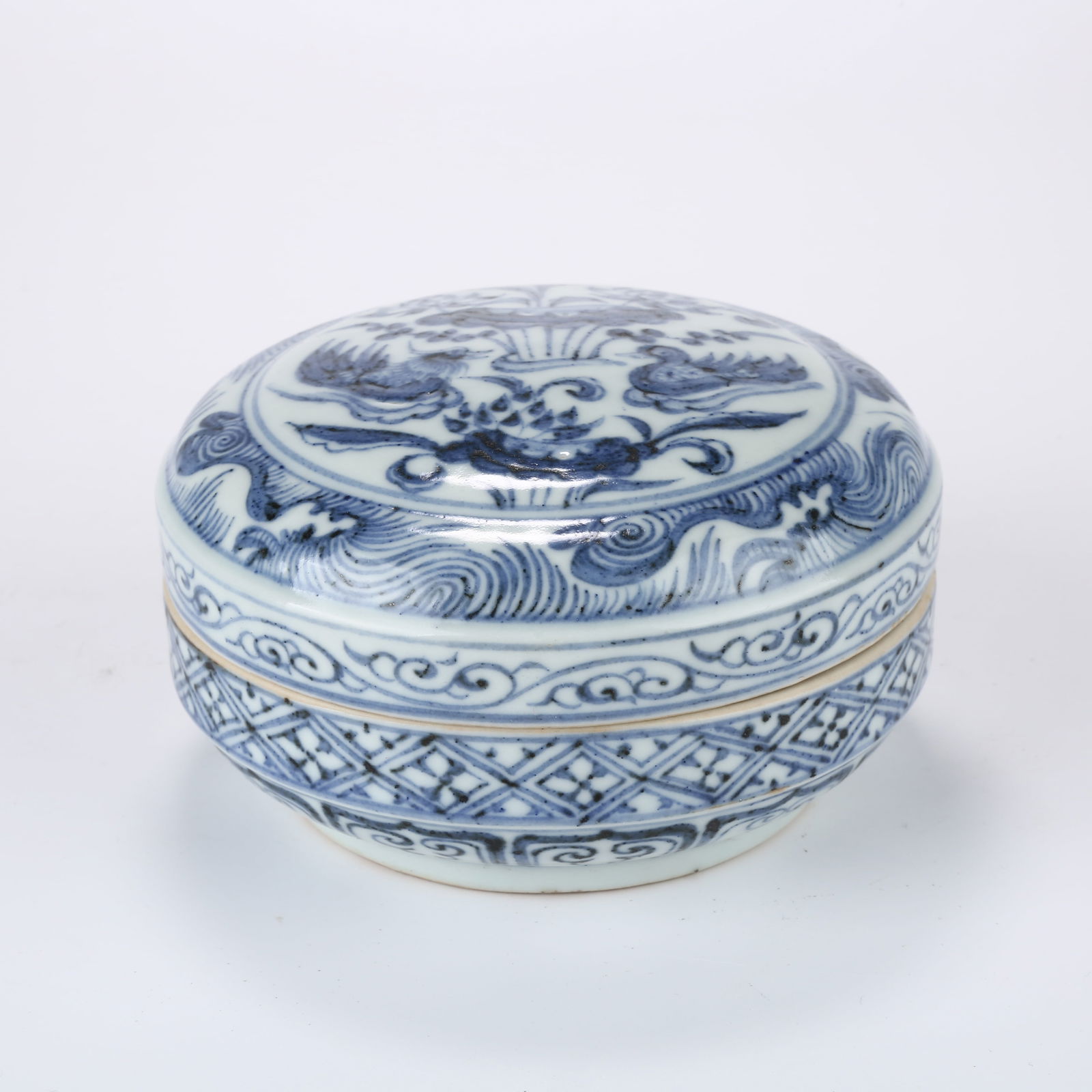 A BLUE AND WHITE COVERED BOX WITH MANDARIN DUCKS IN A LOTUS POND: Blue and White Covered Box with Mandarin Ducks in a Lotus Pond