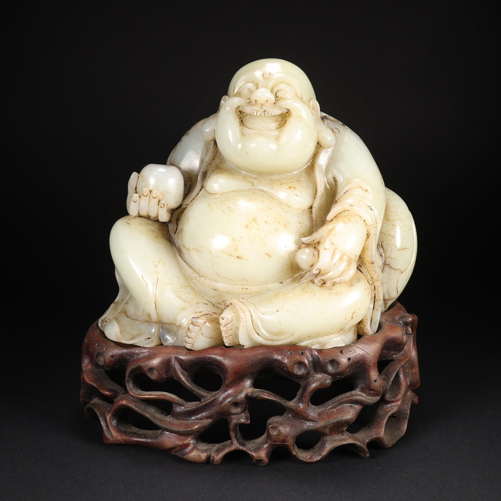 A HETIAN JADE MAITREYA BUDDHA ON WOODEN BASE: Hetian Jade Maitreya Buddha on Wooden Base
