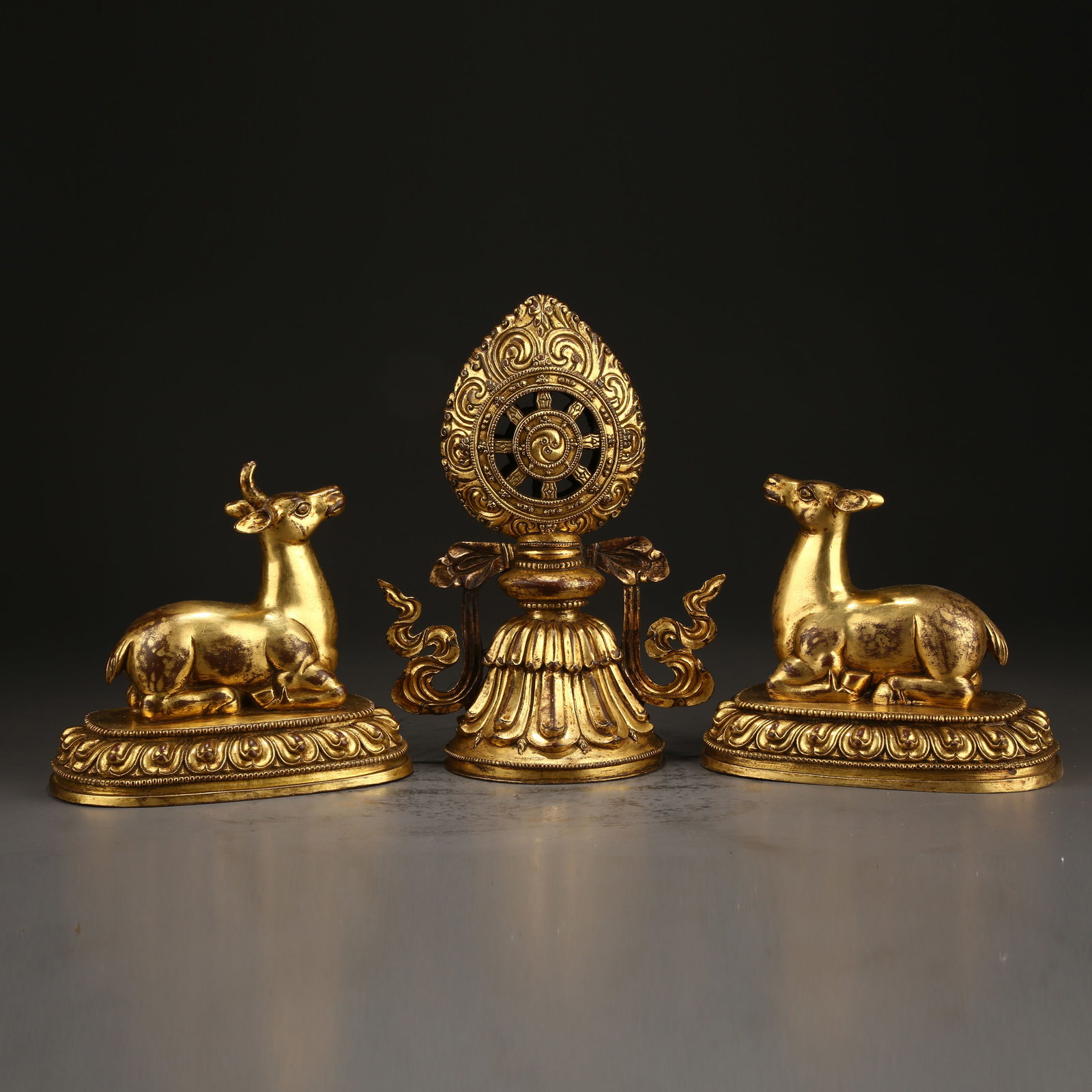 A GILT BRONZE DHARMA WHEEL WITH TWO DEER: Gilt Bronze Dharma Wheel with Two Deer